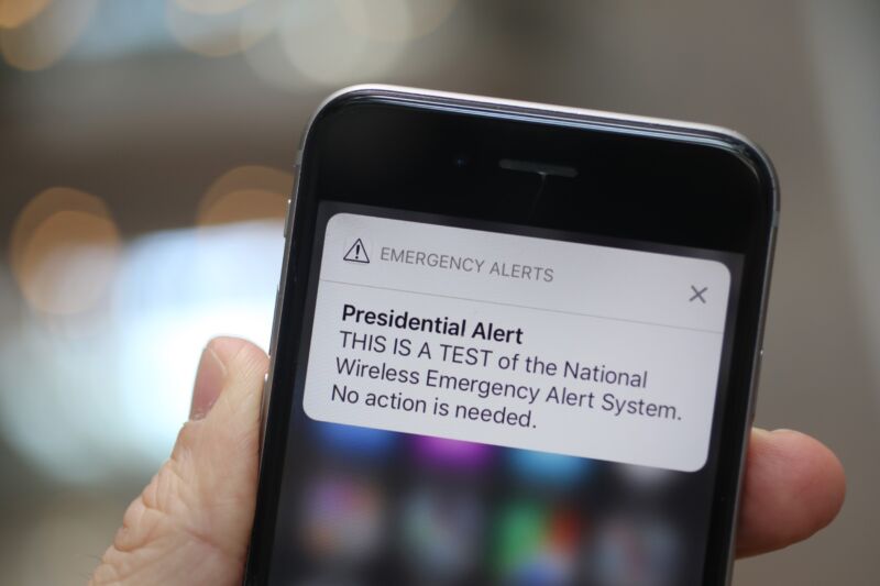 A phone alert reads, 