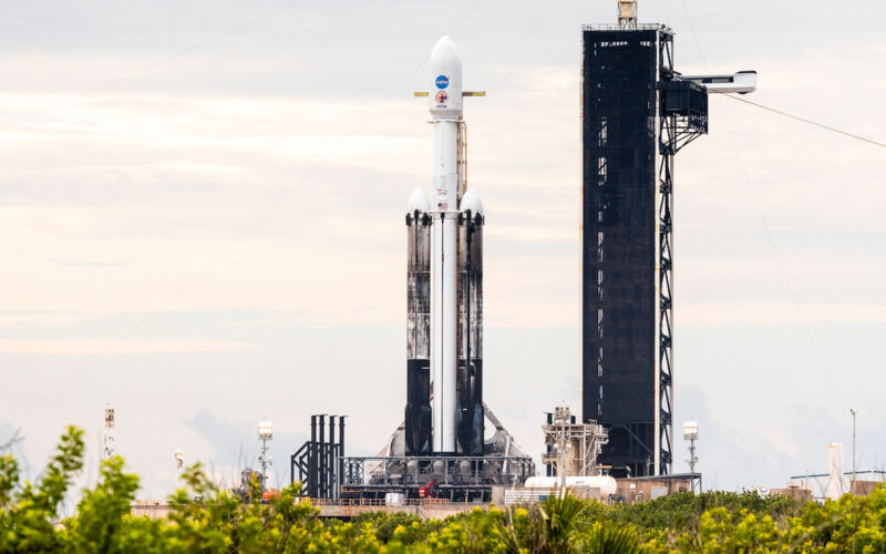 NASA's Psyche spacecraft is cocooned inside the payload shroud on top of SpaceX's Falcon Heavy rocket.