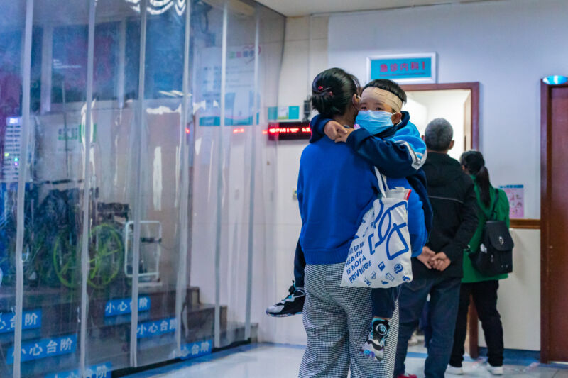 Parents with children who are suffering from respiratory diseases are lining up at a children's hospital in Chongqing, China, on November 23, 2023.