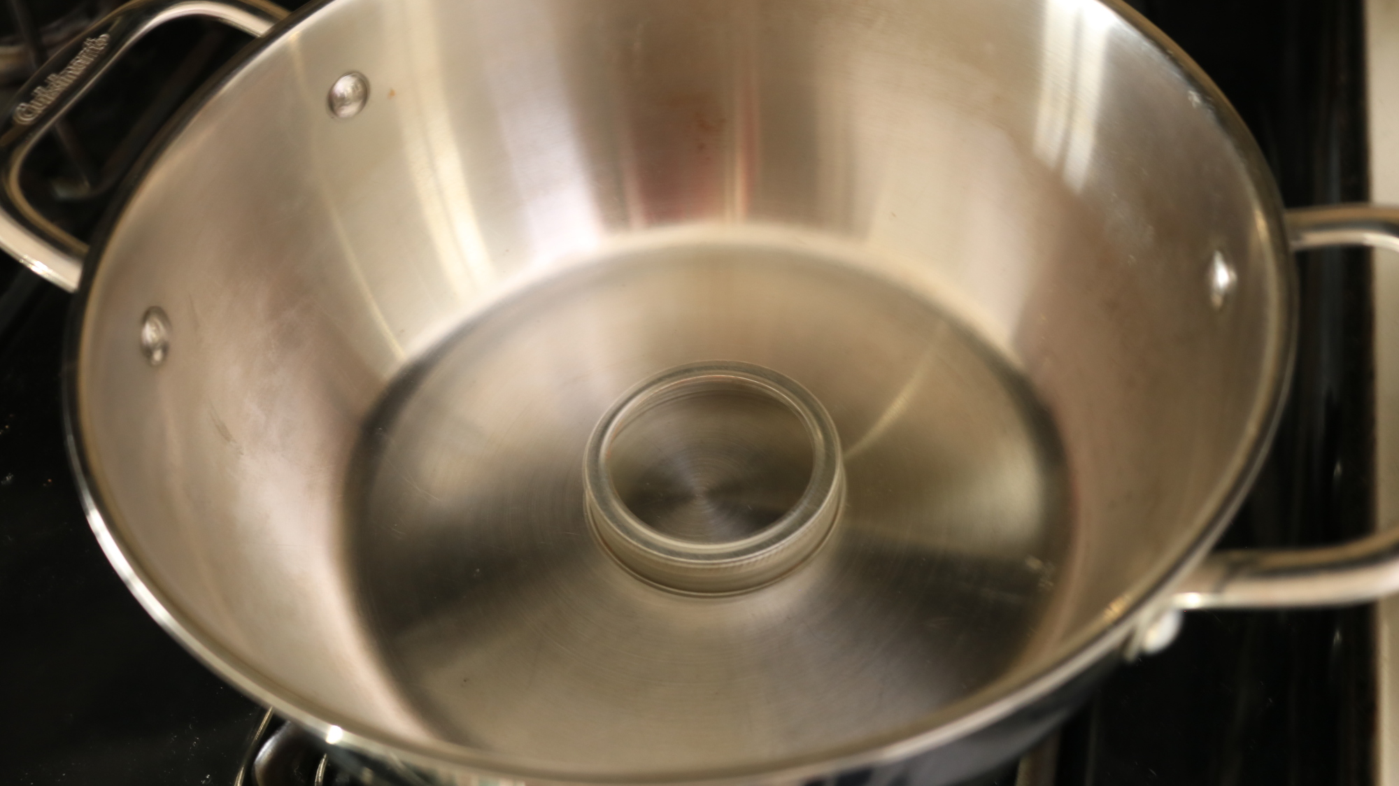 A mason jar ring in a pot.