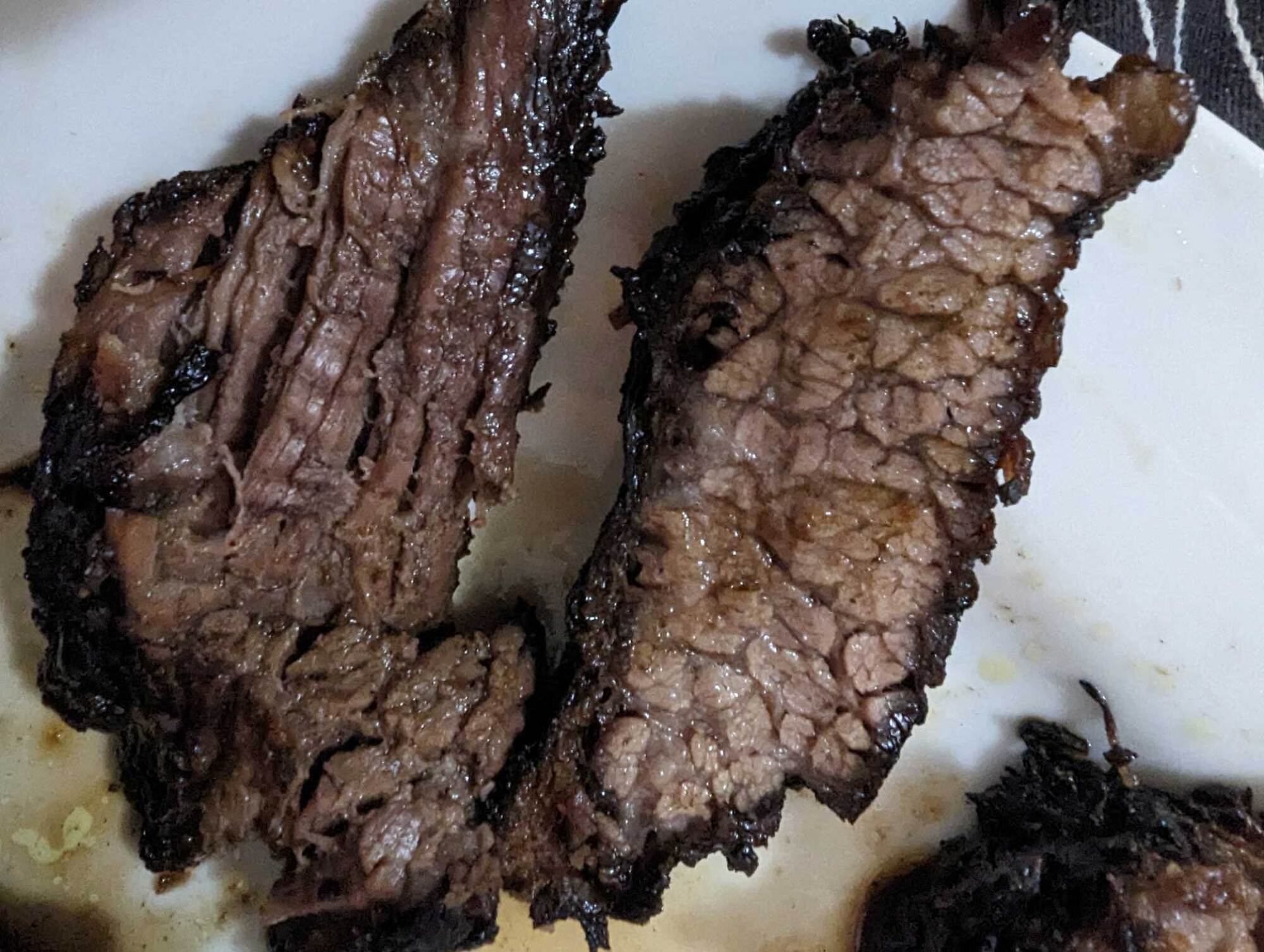 close up of flat and point cut of finished brisket