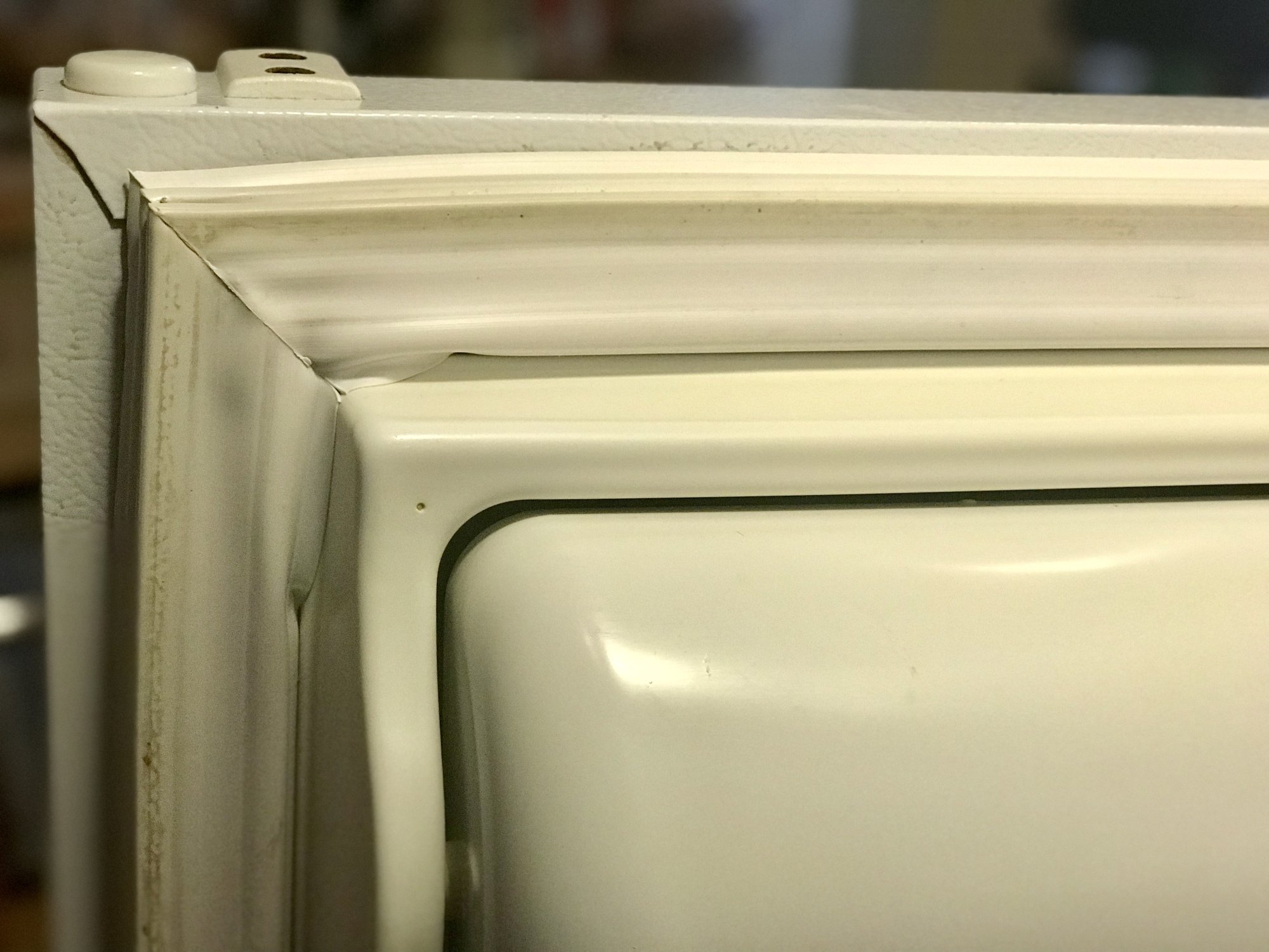 dirty white refrigerator seal gasket