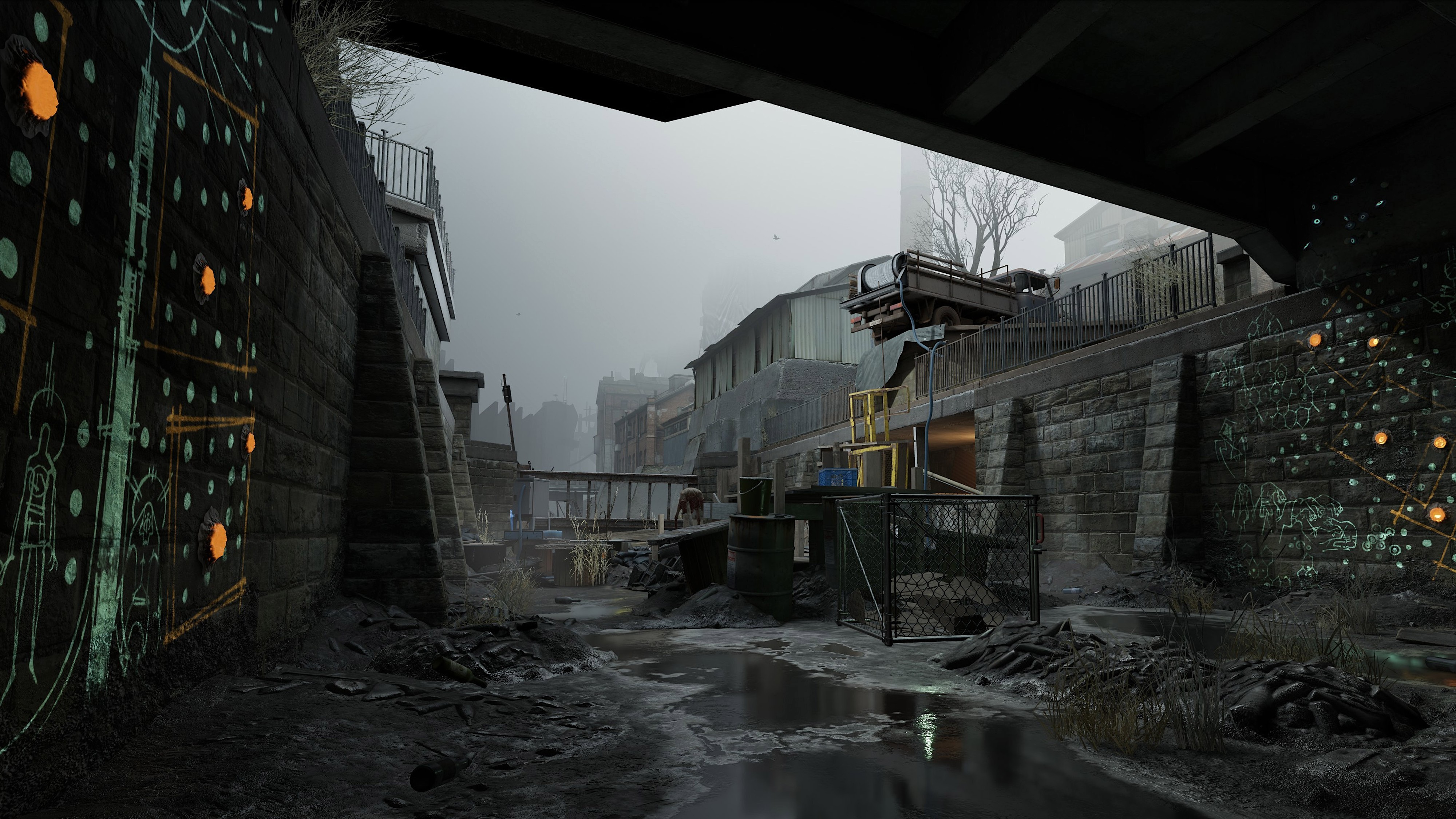 Gloomy canal ruins with graffiti, debris and fog, surrounded by dilapidated buildings and metal fences.