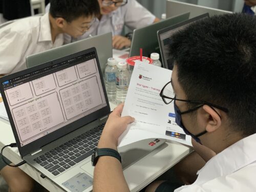 Photo of a young person learning about AI on a laptop.