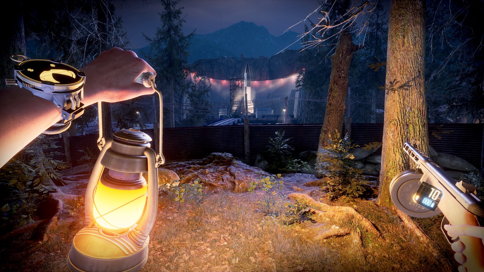 With a lantern in his left hand and a rifle in his right, the player looks down on a missile launch base.