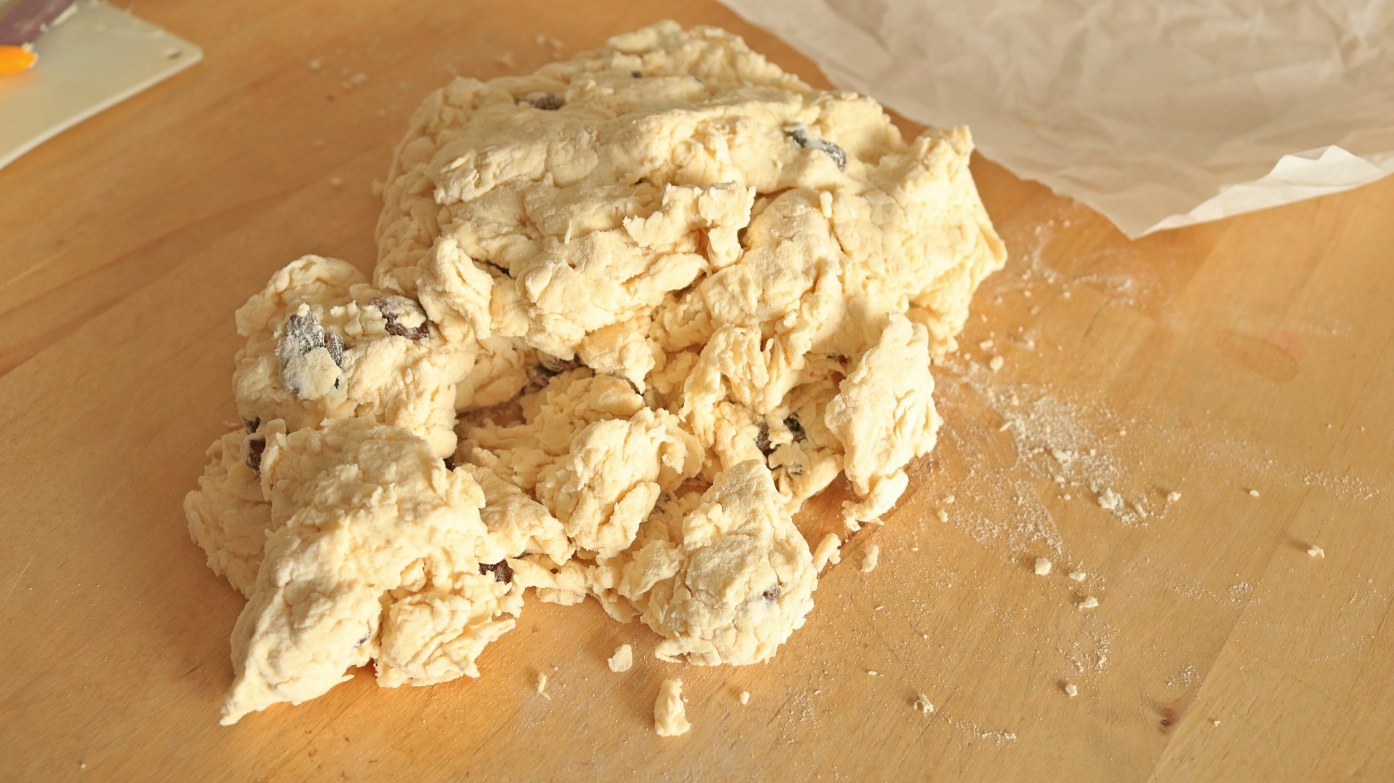 Clumpy dough on a countertop.