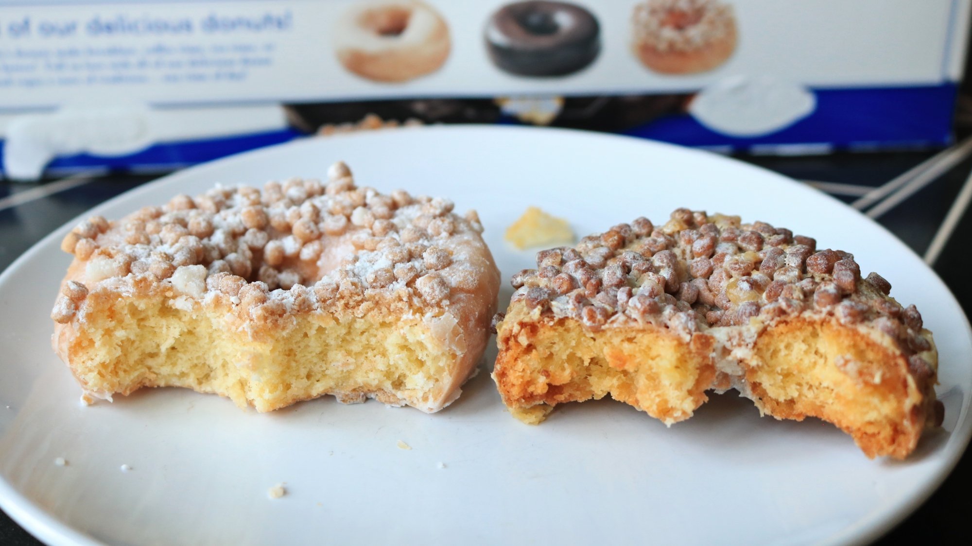 Two Entenmann's doughnuts, one air-fried, side by side on a plate.