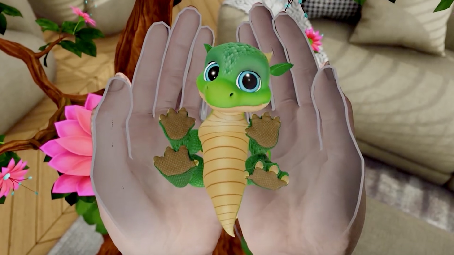 A baby dragon is in the player's hand.
