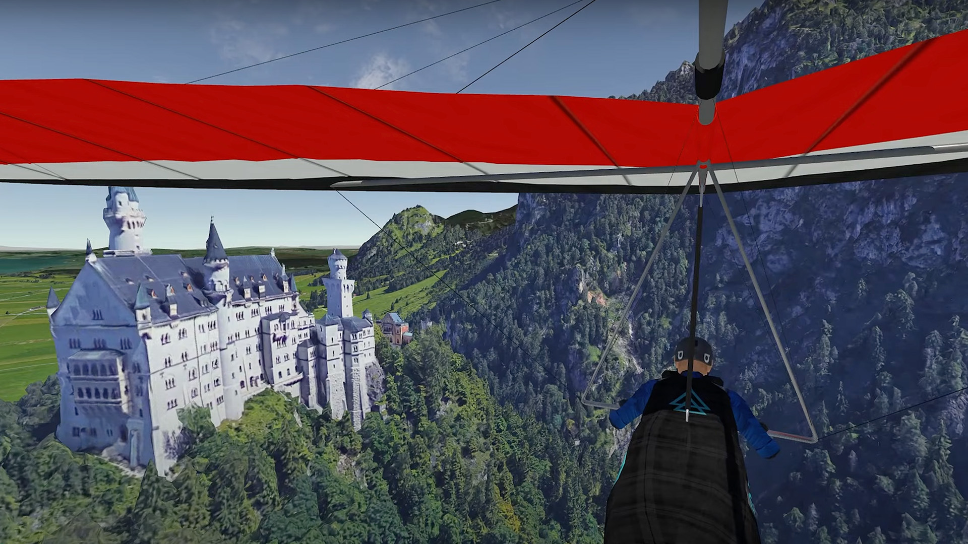 Hang-glider over Neuschwanstein Castle, view of the castle and the wooded mountains from the pilot's perspective.
