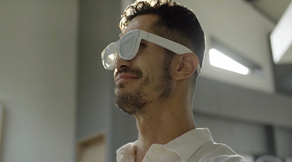 Man with white AR glasses on face