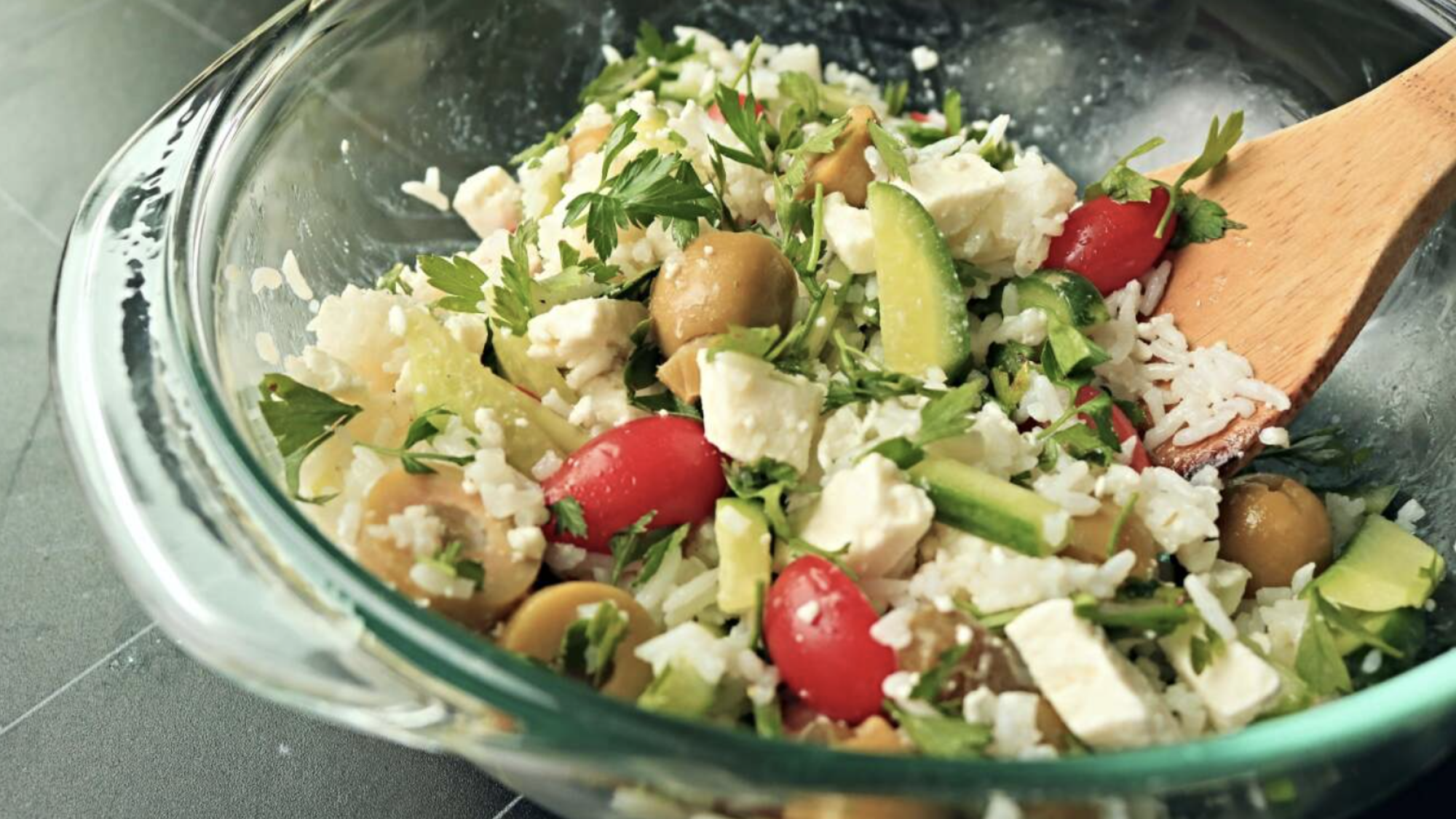 Rice and vegetable salad on a table.