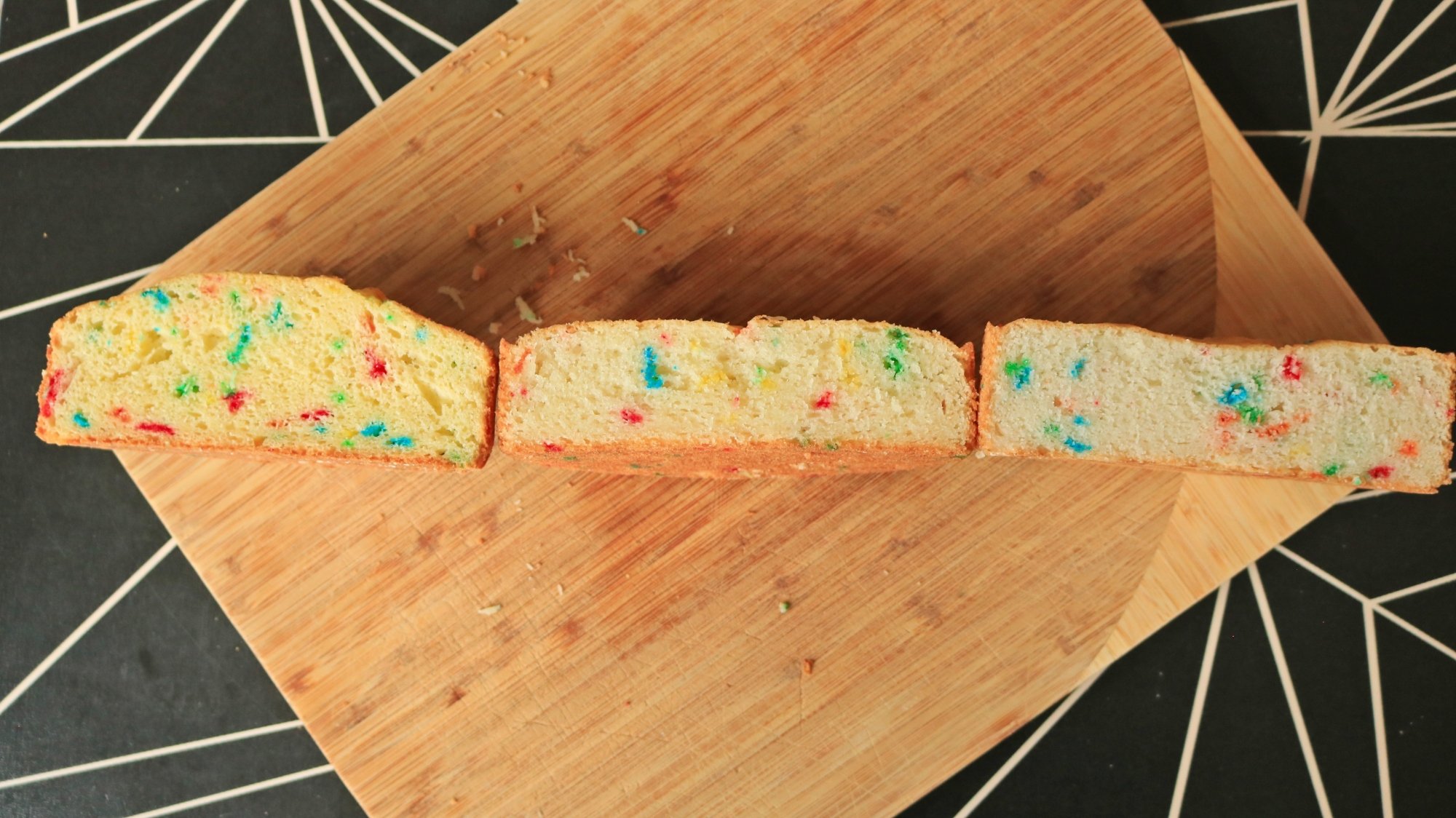 Three cakes cut in half next to each other to show the difference in height.