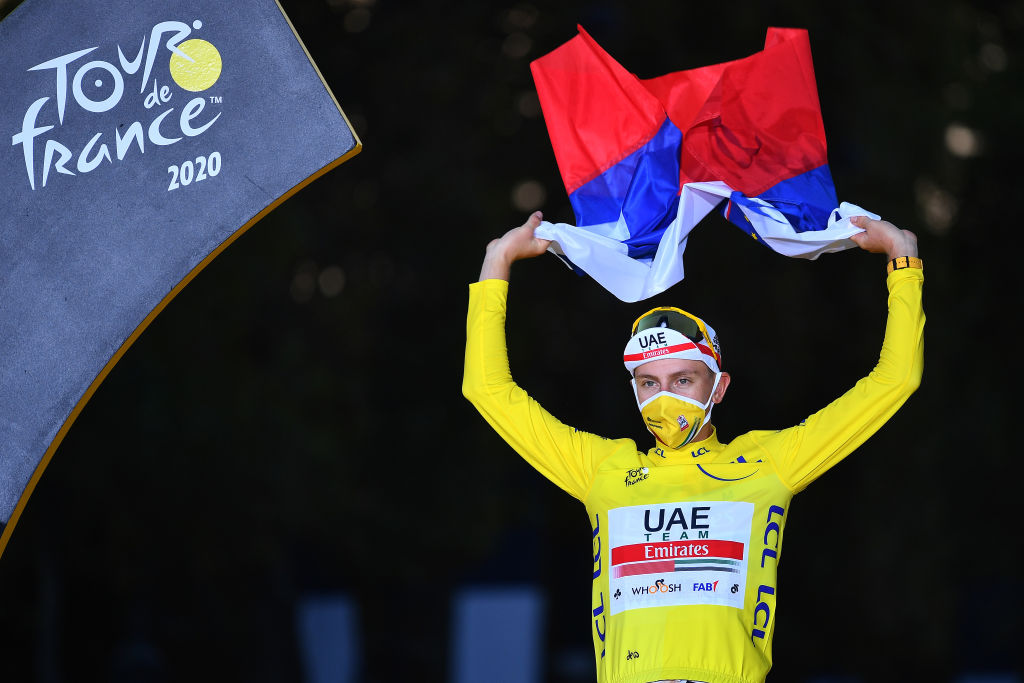PARIS, FRANCE - SEPTEMBER 20: Podium / Tadej Pogacar of Slovenia and UAE Team Emirates Yellow Leader Jersey / Celebration / Trophy / Slovenian Flag / during the 107th Tour de France 2020, Stage 21 a 122km stage from Mantes-La-Jolie to Paris Champs-Élysées / #TDF2020 / @LeTour / on September 20, 2020 in Paris, France. (Photo by Stuart Franklin/Getty Images,)