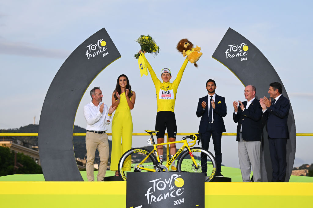 NICE, FRANCE - JULY 21: Tadej Pogacar of Slovenia and UAE Team Emirates celebrates at podium as final Yellow Leader Jersey winner (with his Colnago Bike) with the presence of (L-R) Albert II, Prince of Monaco and Christian Estrosi - Mayor of Nice during the 111th Tour de France 2024, Stage 21 a 33.7km individual time trial from Monaco to Nice / #UCIWT / on July 21, 2024 in Nice, France. (Photo by Tim de Waele/Getty Images)