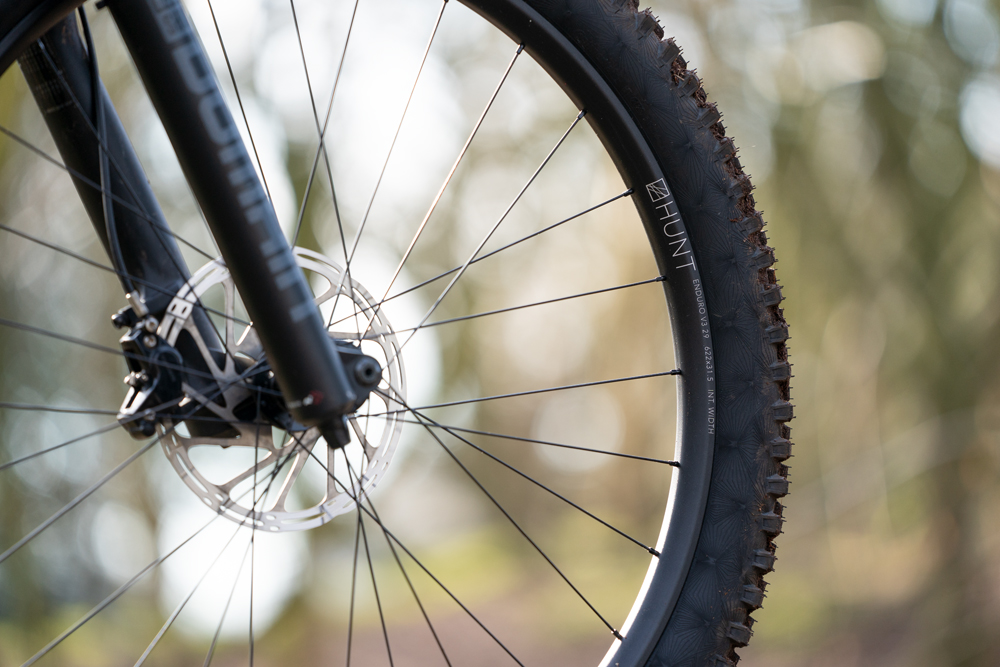 Shot peening used on alloy rim for strength.