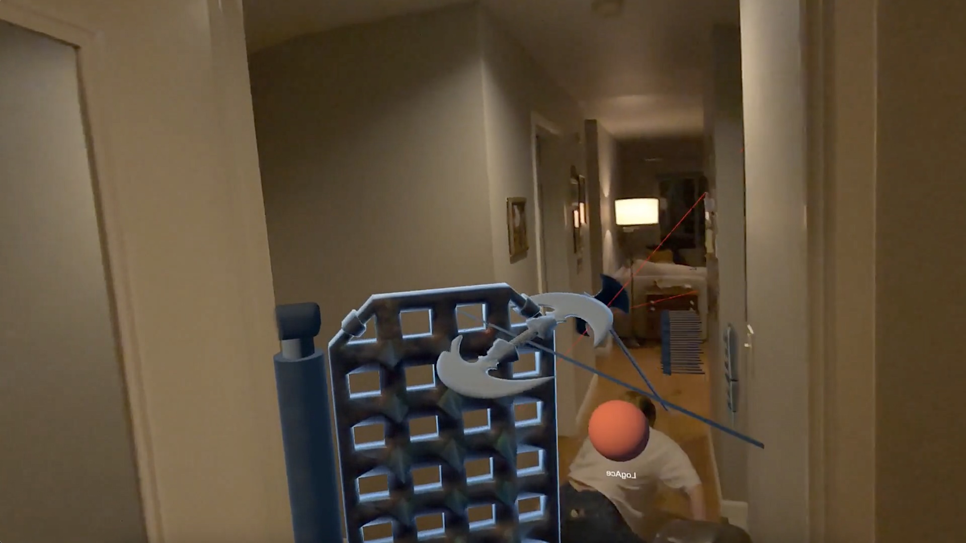 A woman crawls through a corridor in her apartment, surrounded by mixed reality traps.