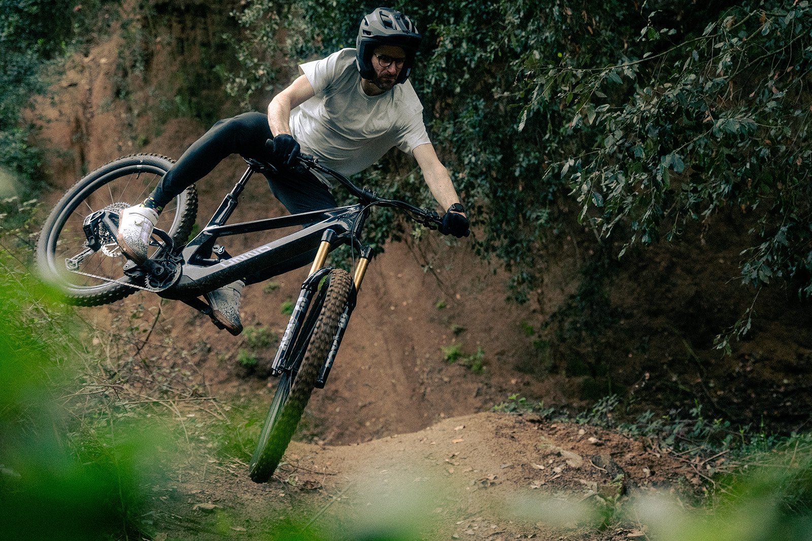 Male rider testing the UNNO MITH full suspension mountain eBike
