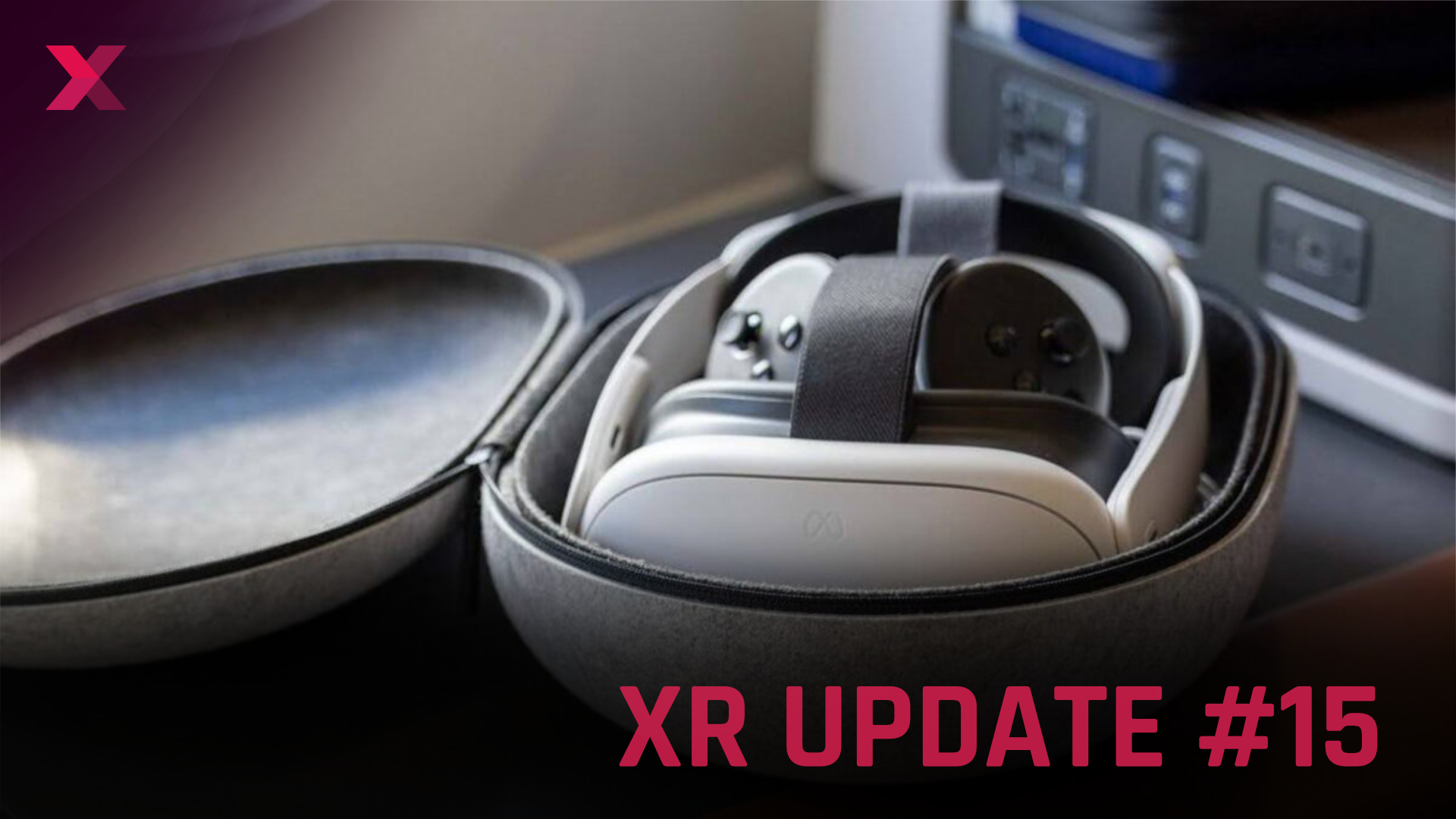 White VR headset and controller in gray, open transport box, in the background a part of the aircraft interior.
