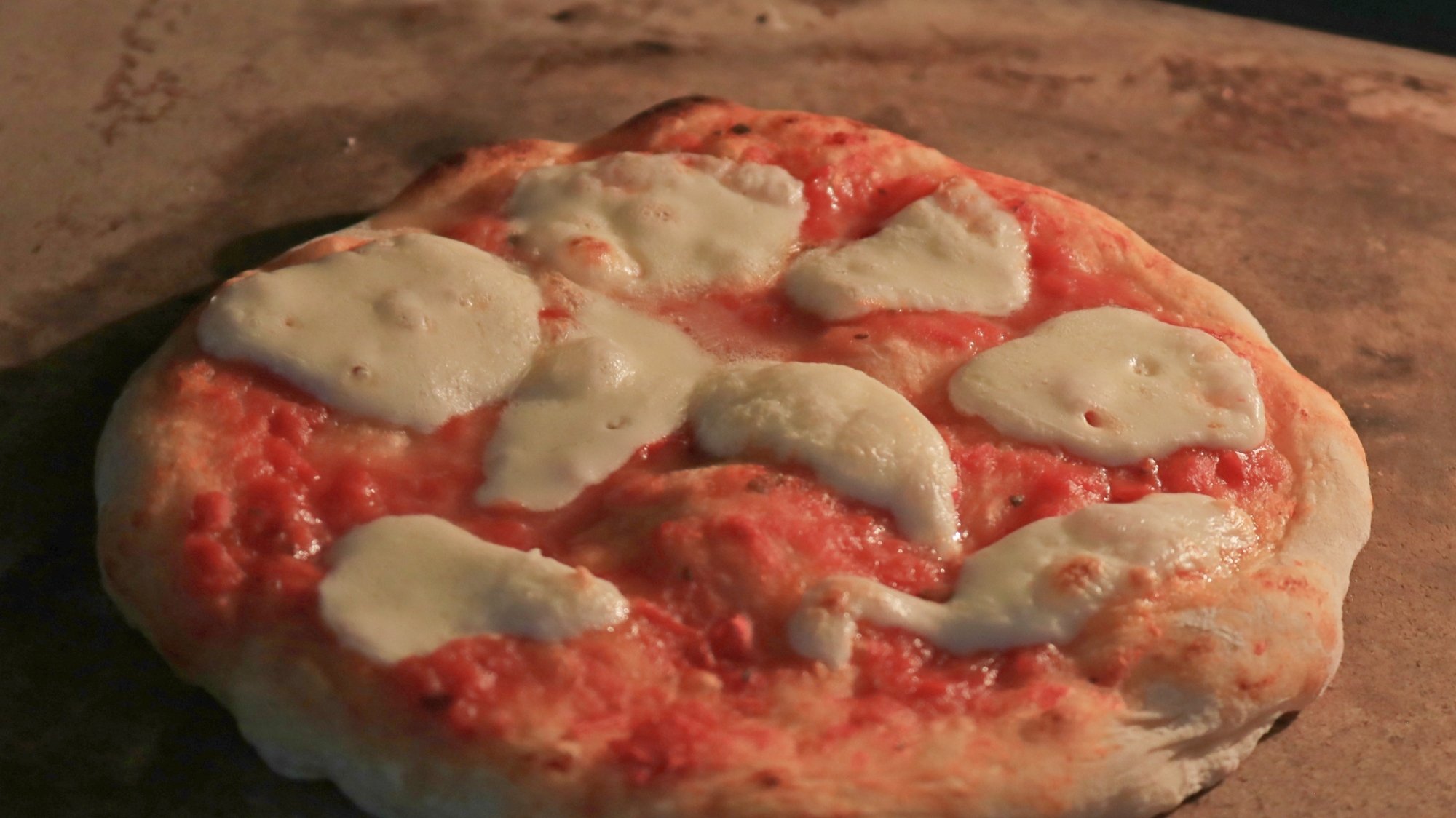 Pizza with melted mozzarella.