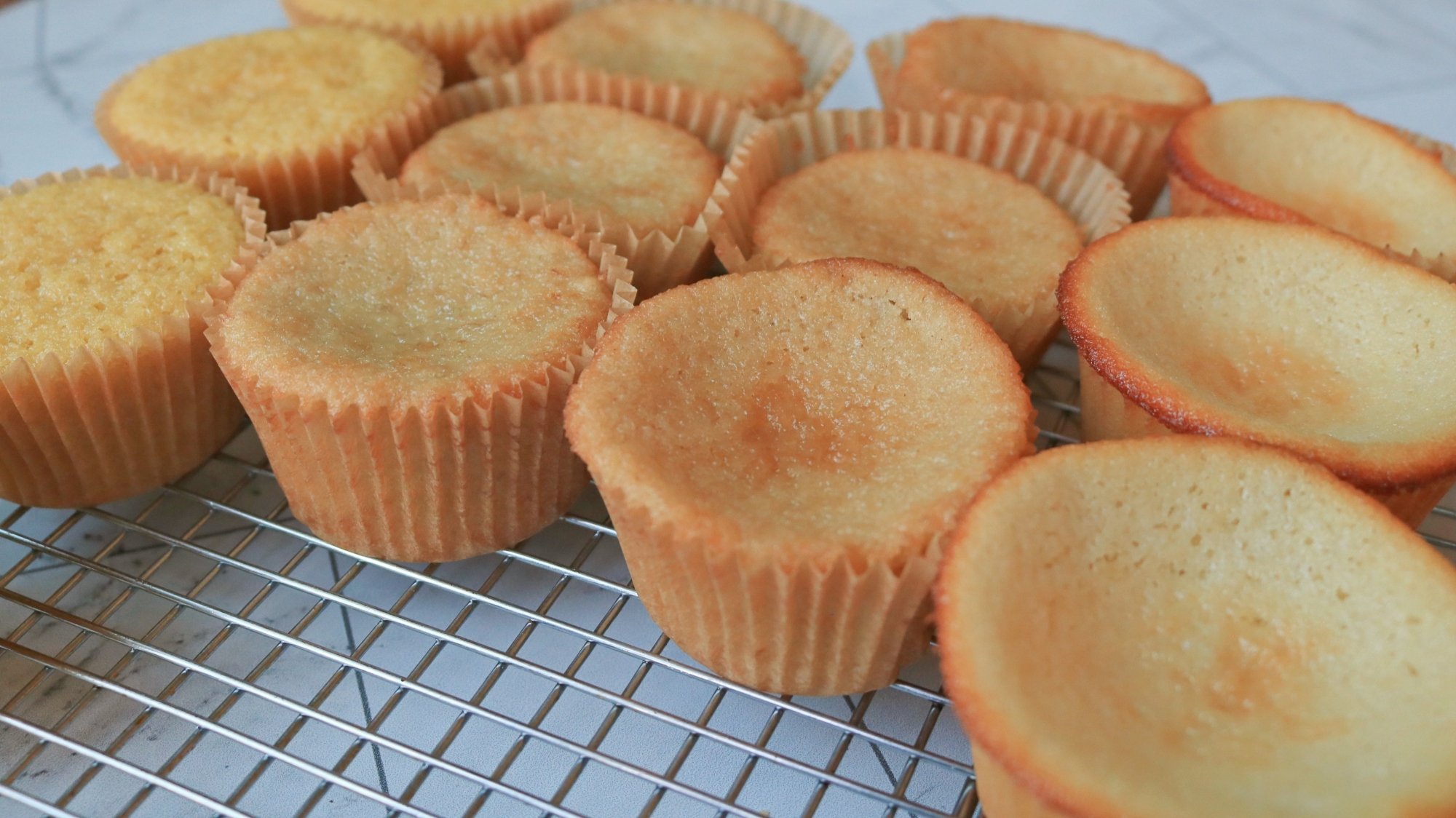 Cupcakes on a wire cooling rack.