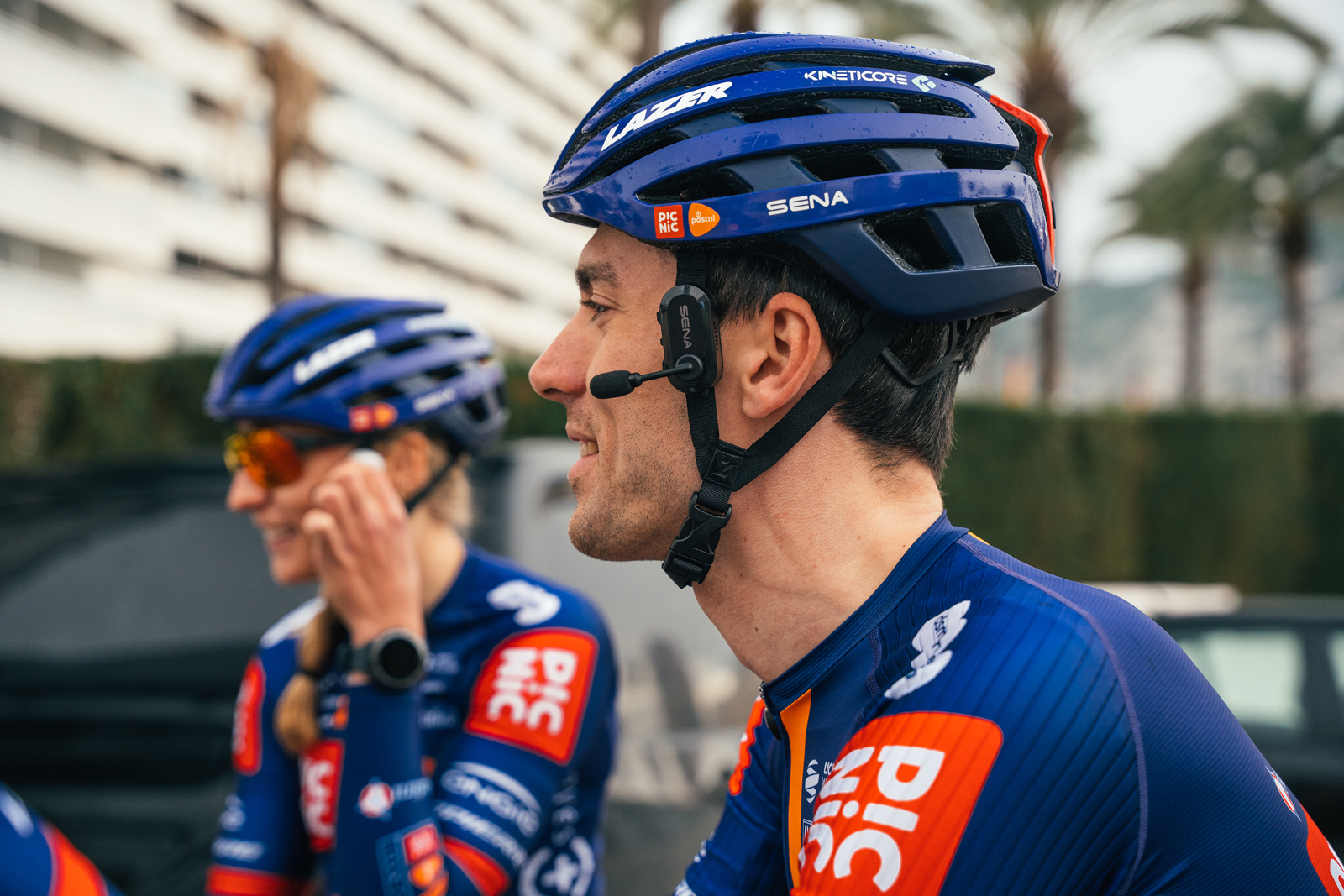 Man wearing helmet fitted with Sena BiKom 20 device.