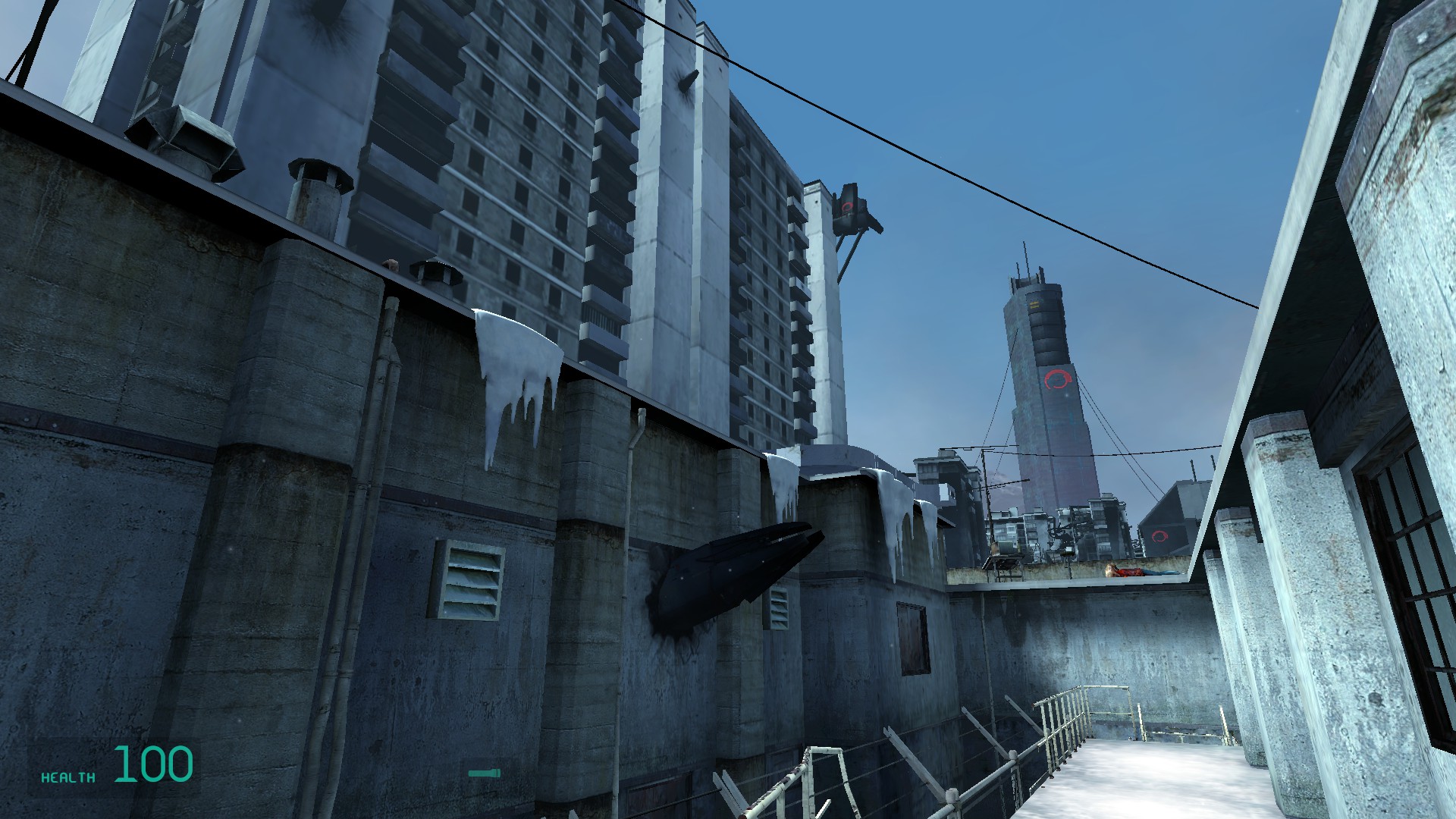 View of a dystopian city with a Combine base in the distance.