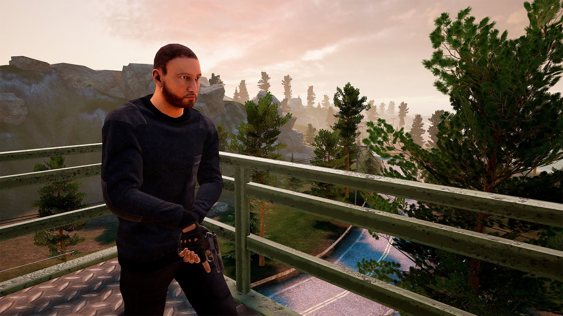 Man with gun standing on bridge with view of wooded landscape at sunrise.