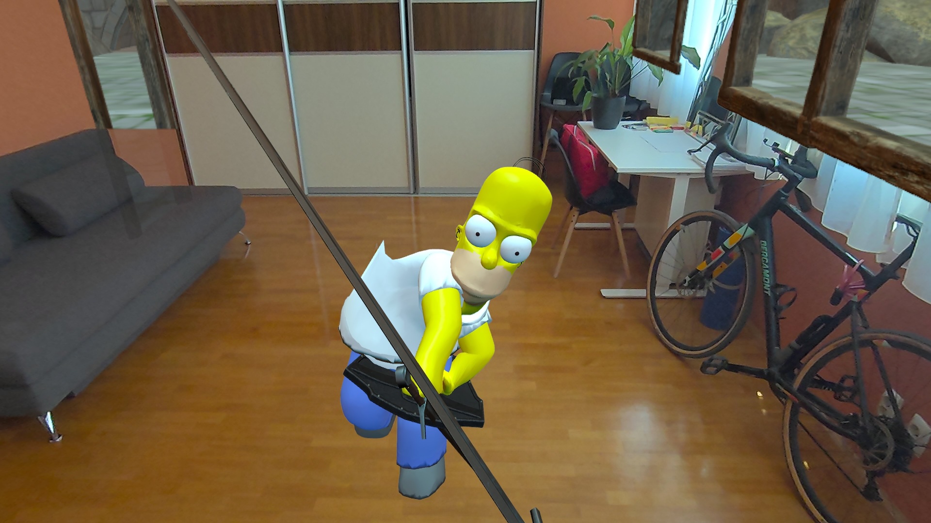 An MR version of Homer Simpson stands in an apartment and fights with the player.