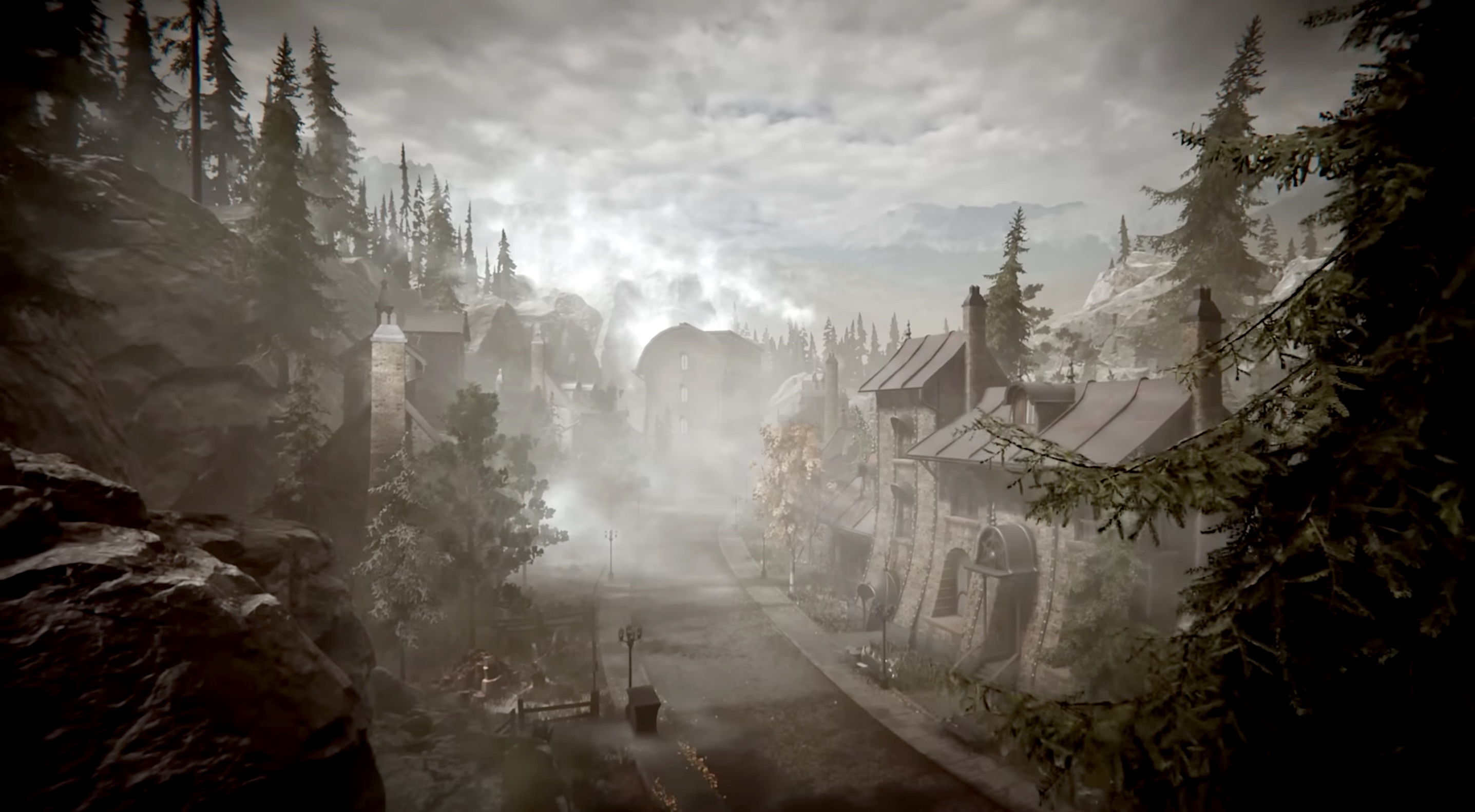 Misty mountain village with stone houses between conifers, dramatic sky and mountain scenery in the background.