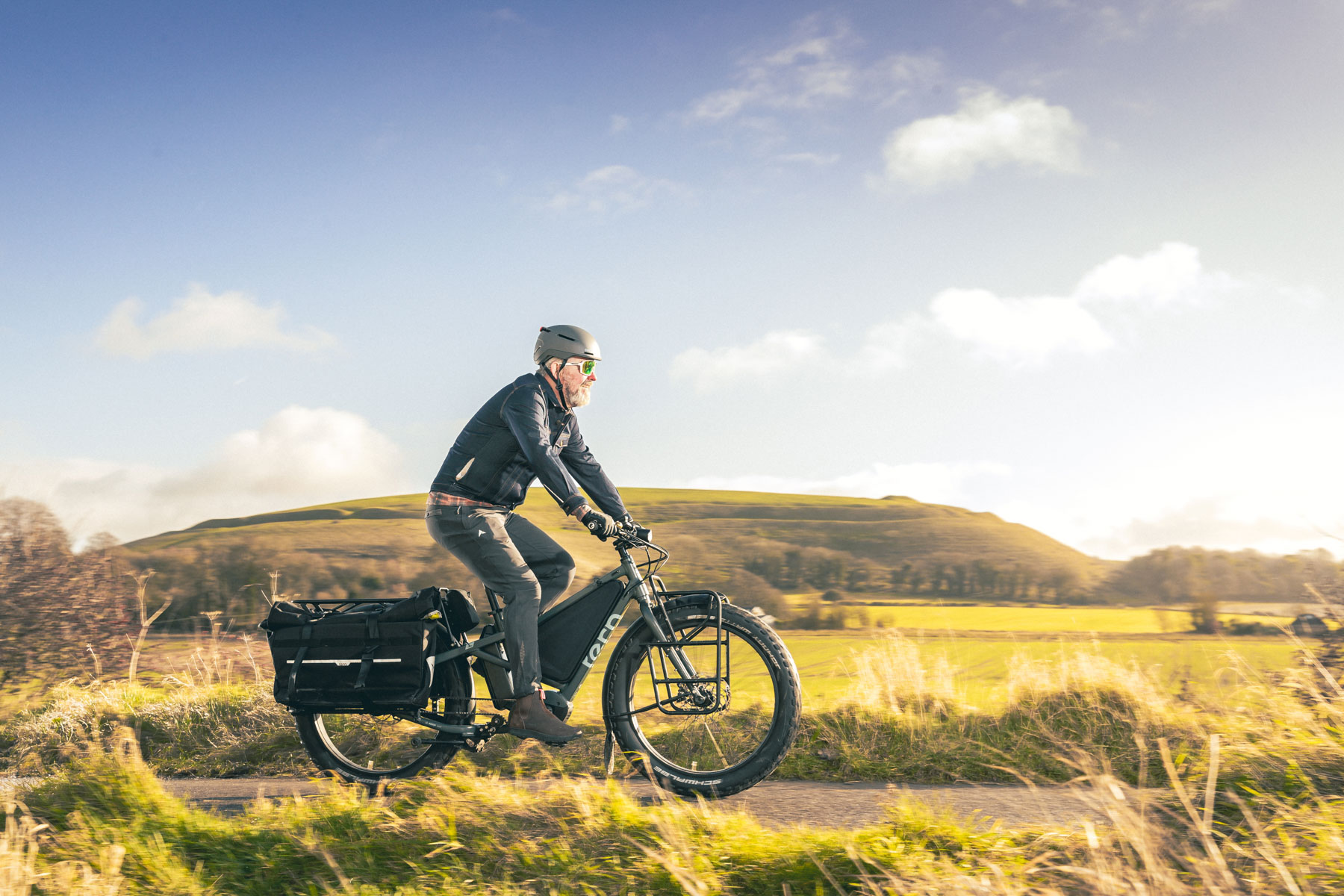Male cyclist riding the Tern Orox Orox R14 electric cargo bike