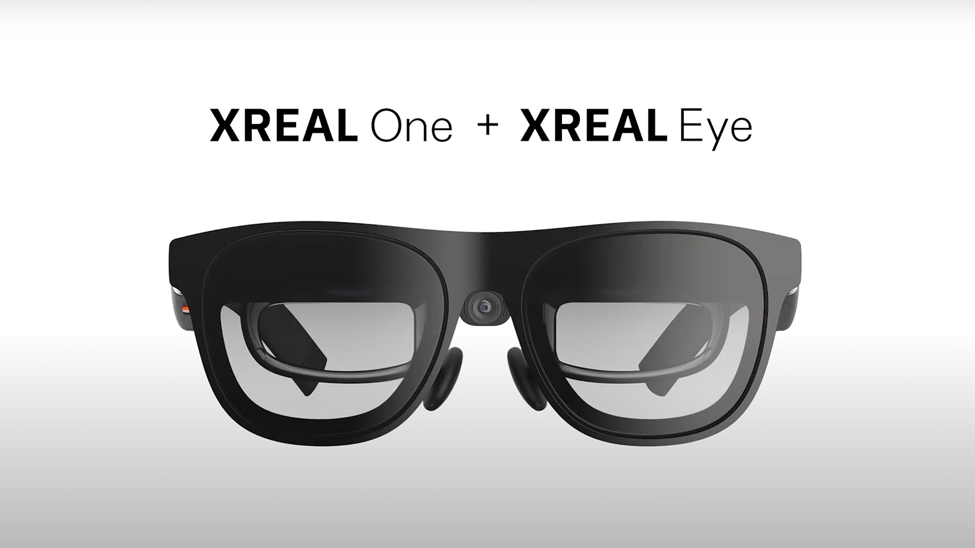 The Xreal One AR headset with Xreal Eye in front of a white background.