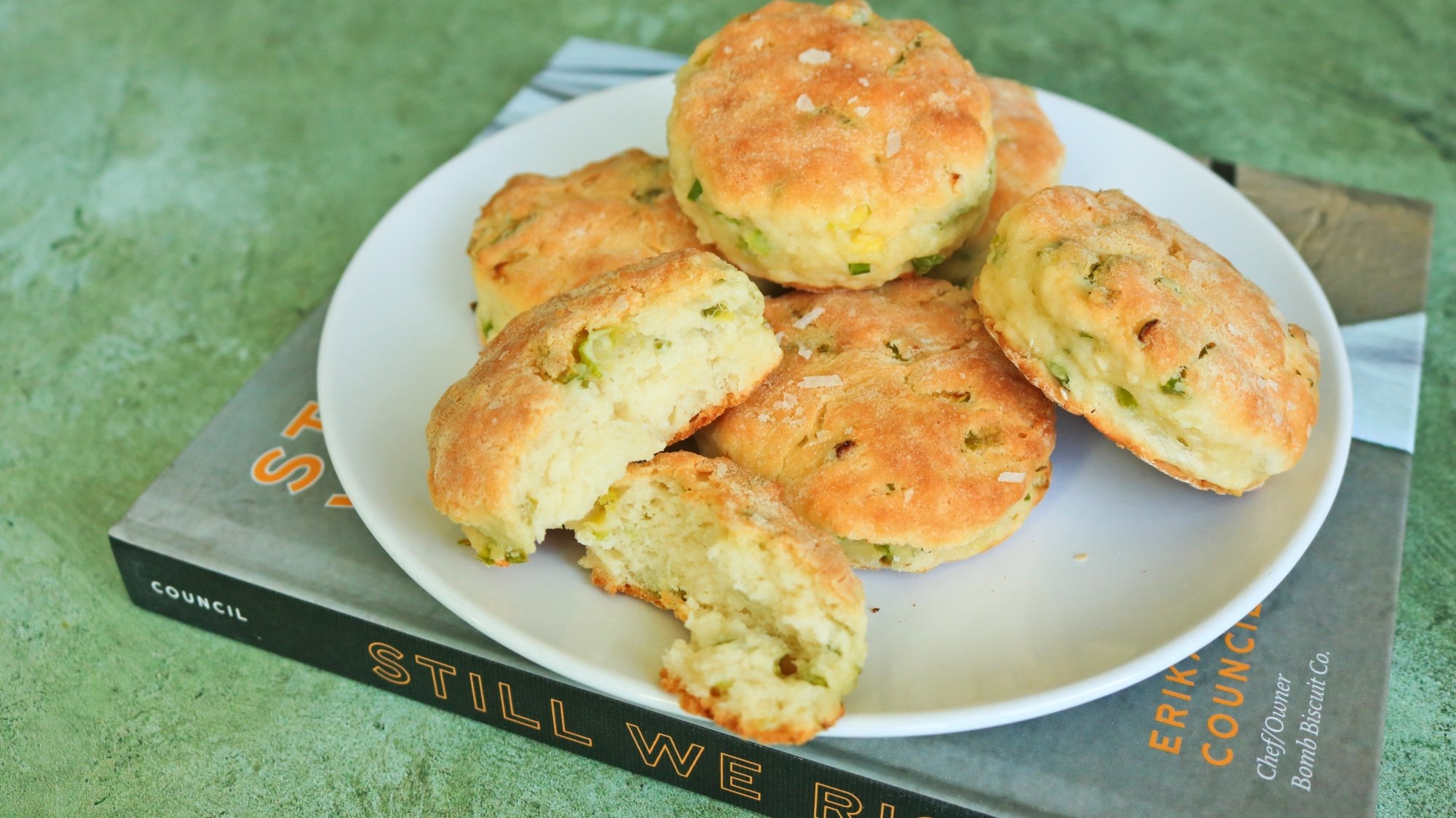 A pile of sour cream and onion biscuits on a plate.