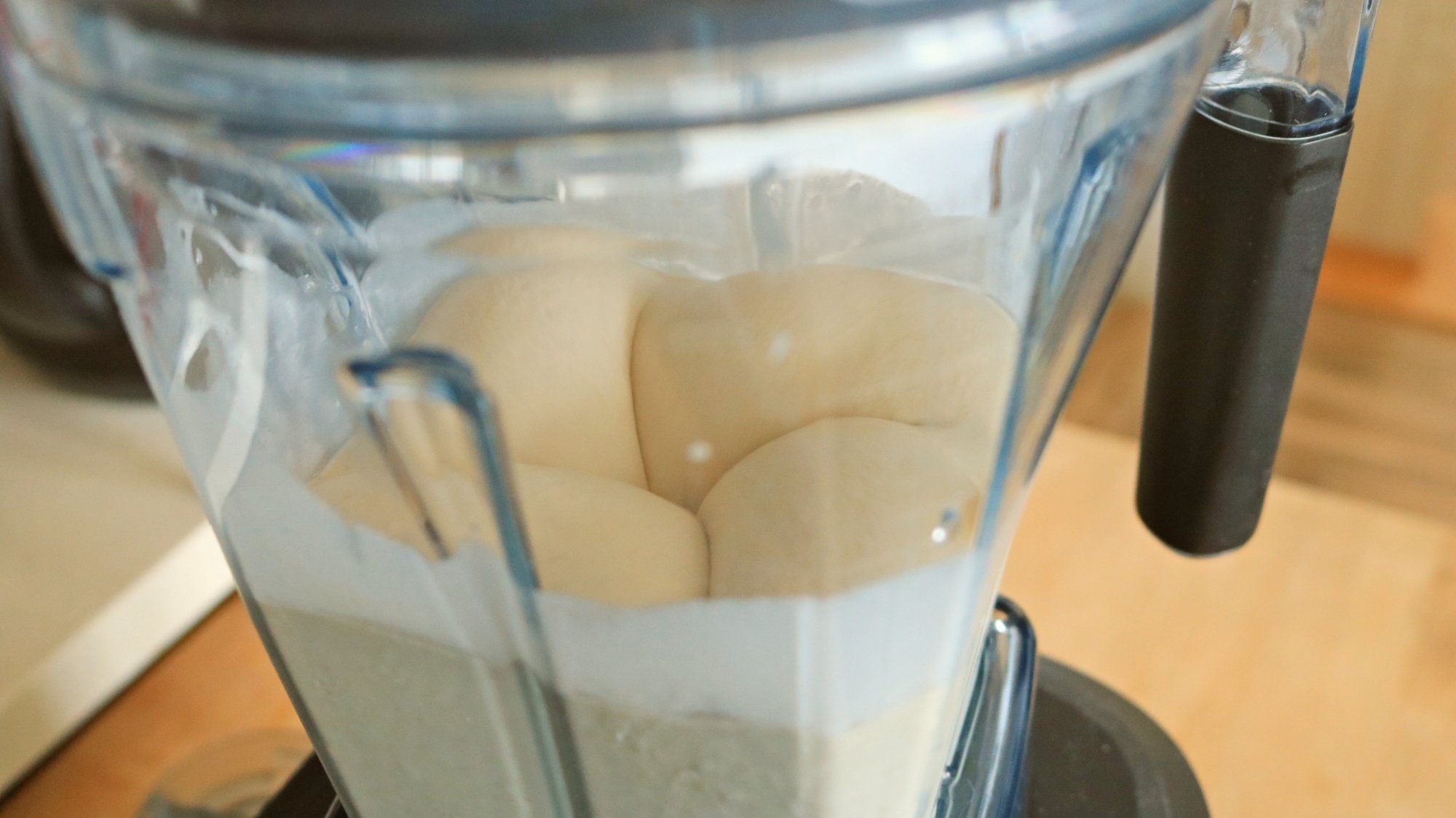 The inside of the vitamix while blending a frozen dessert.