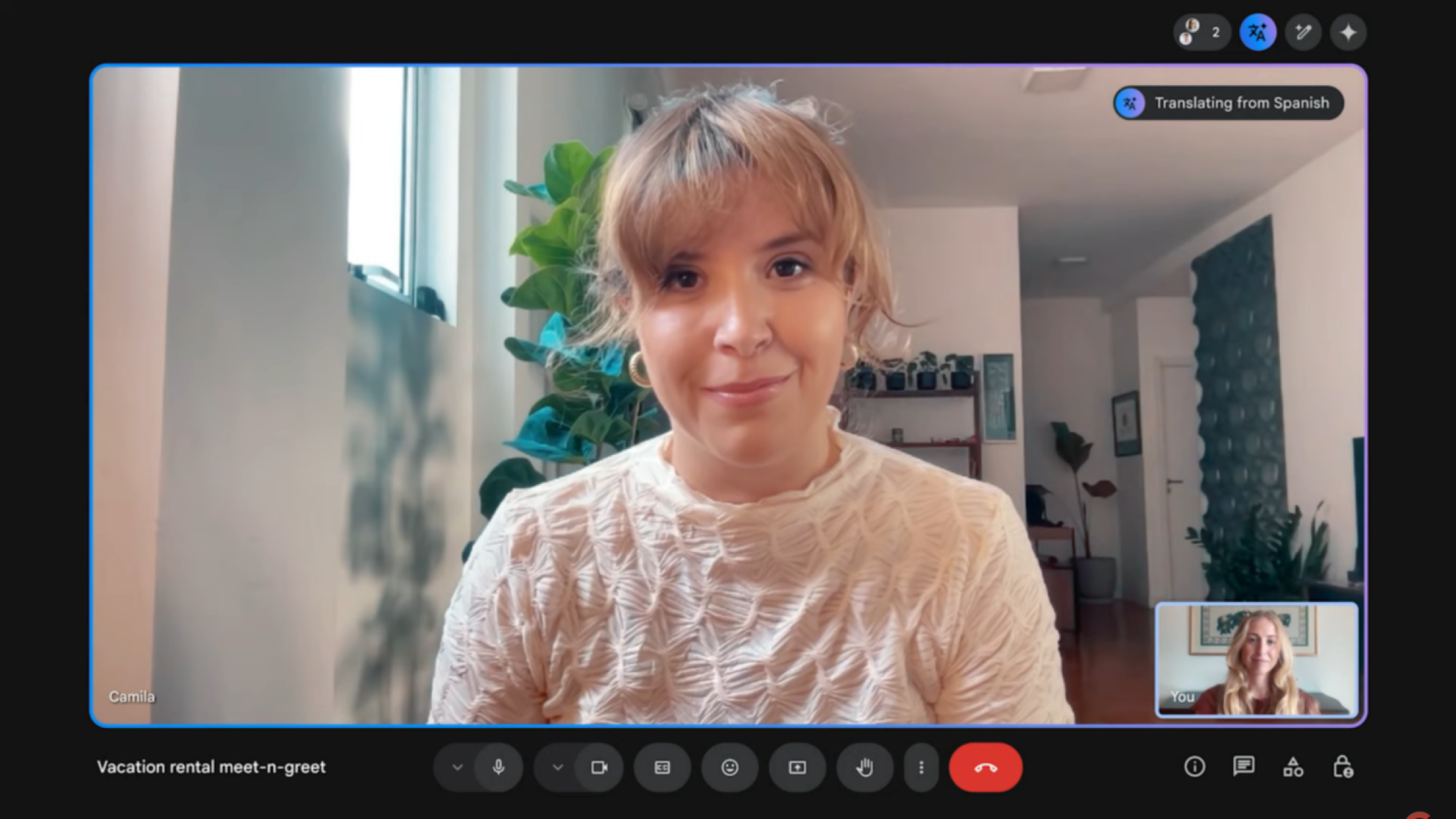 a google meet call between two people. google meet is translating the call from spanish
