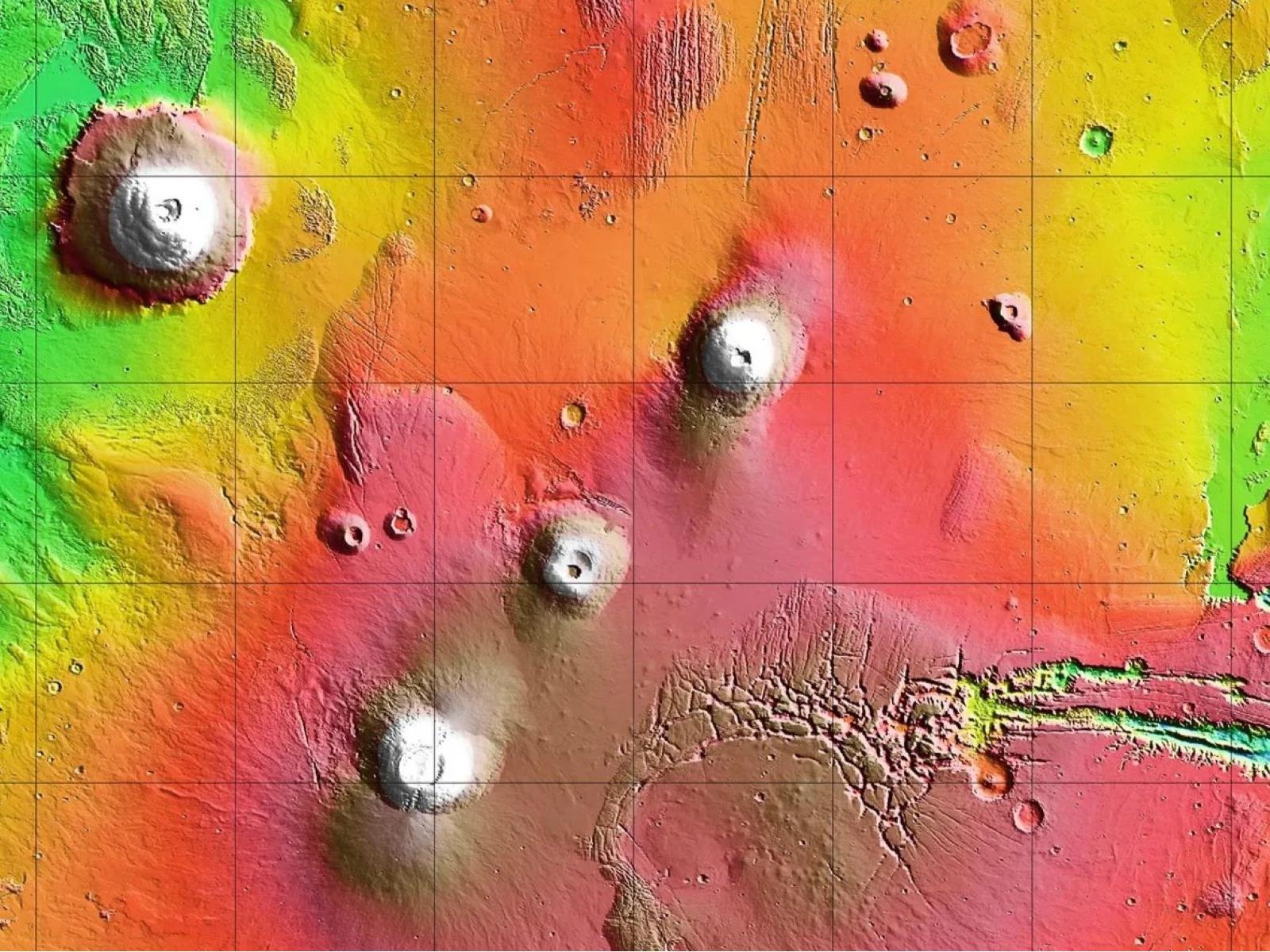 NASA Orbiter Captures Amazing Shot Of 12-Mile High Martian Volcano Above Cloud Tops