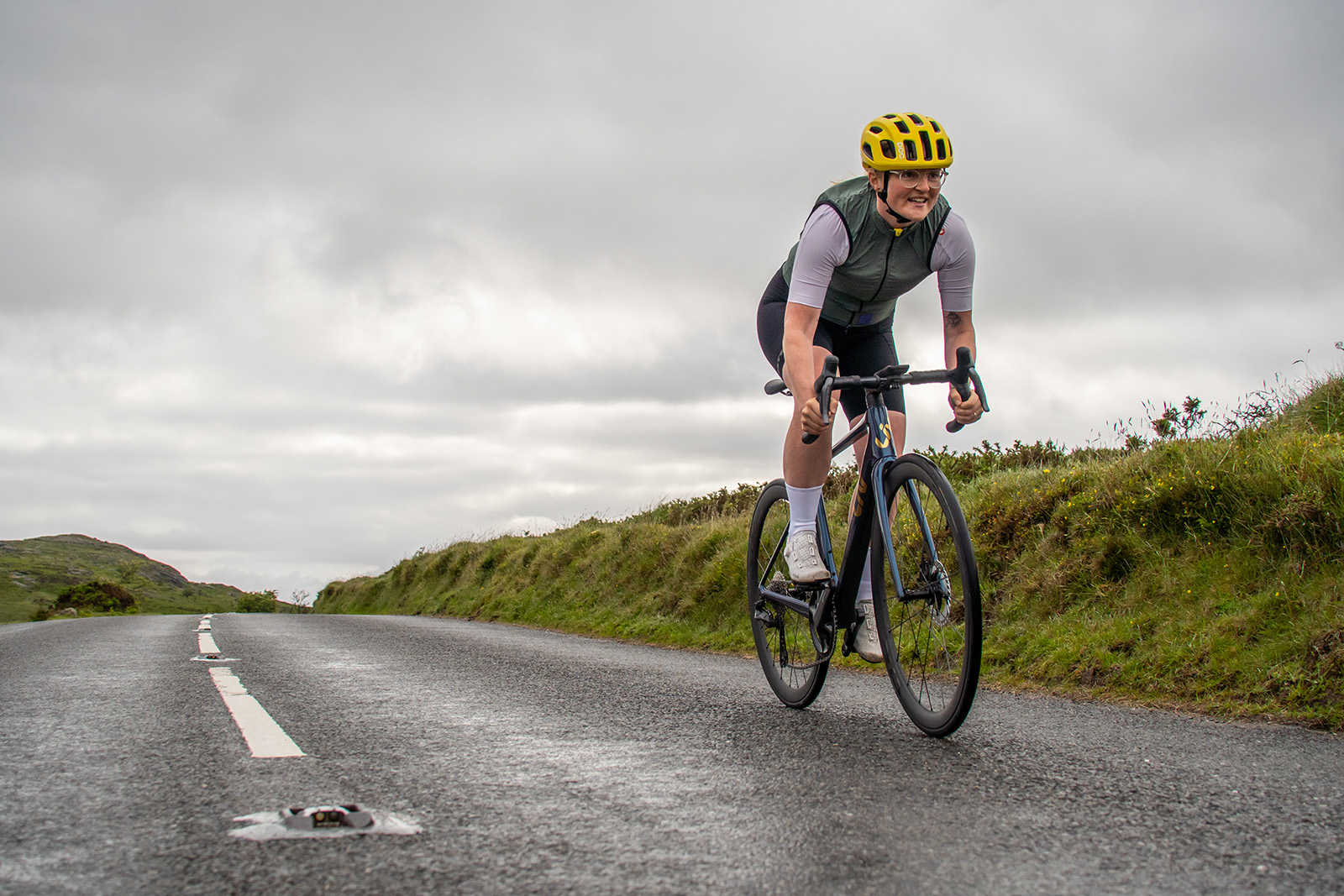 Female cyclist in green top riding the women's specific Liv Langma Advanced Pro 0 road bike