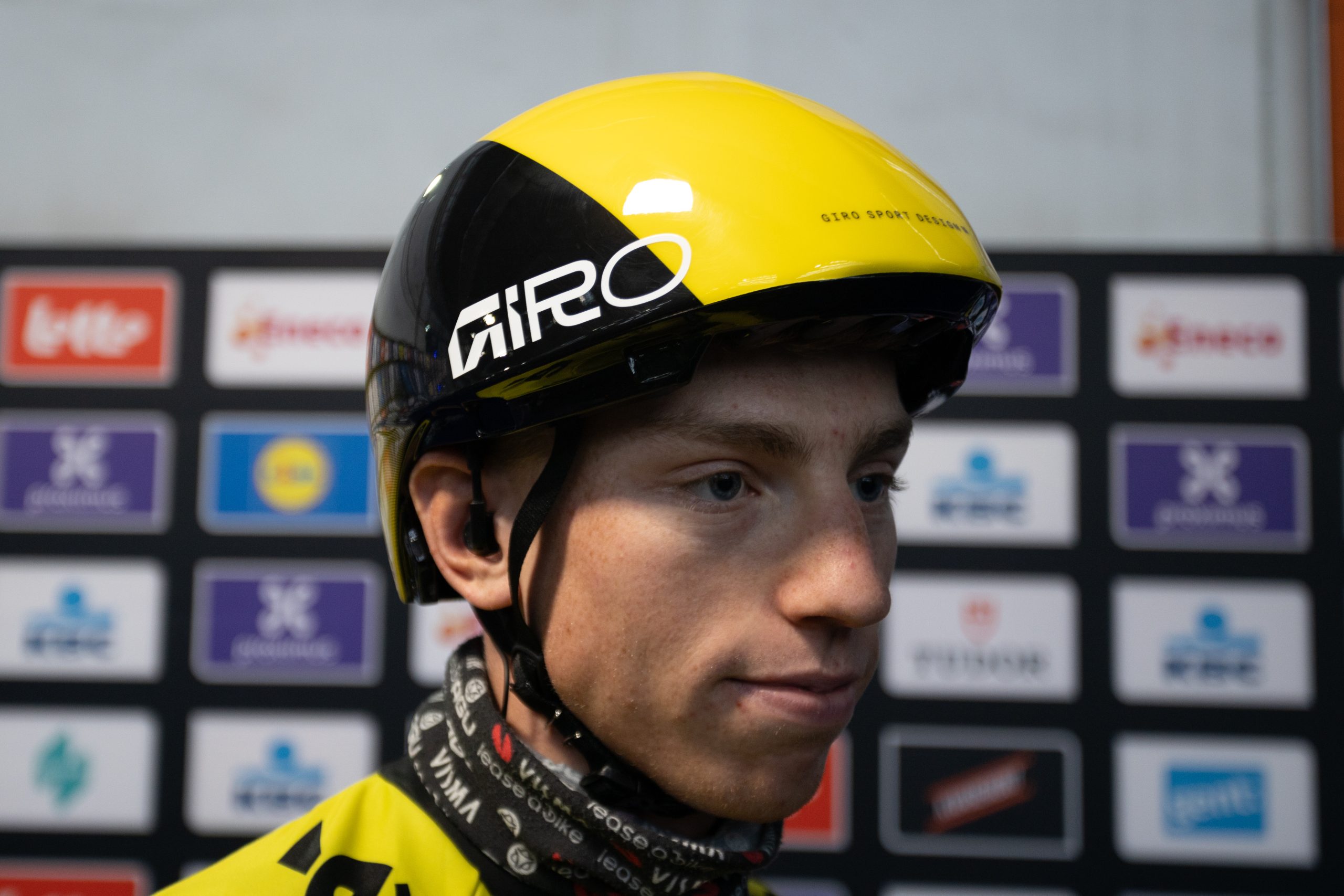 Matthew Brennan of Visma Lease a Bike wears a Giro time trial helmet ahead of Omloop Het Nieuwsblad