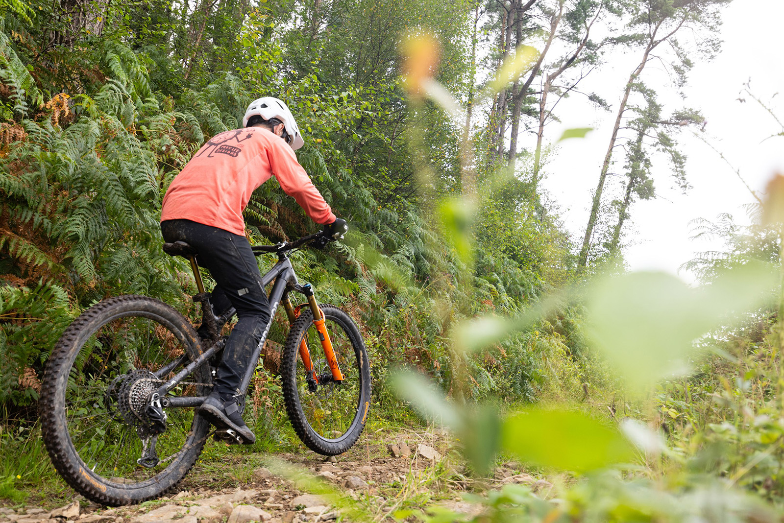 Male mountain biker in red top riding the Atherton A.130.3 mountain bike