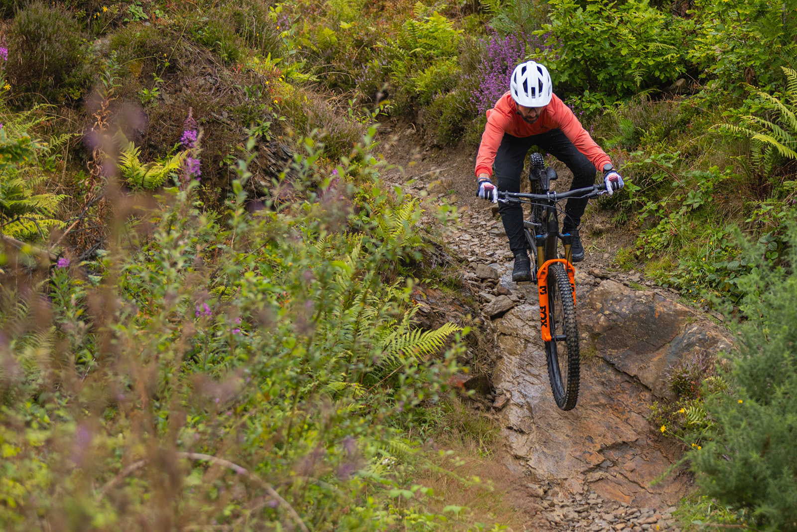 Male mountain biker in red top riding the Atherton A.130.3 mountain bike