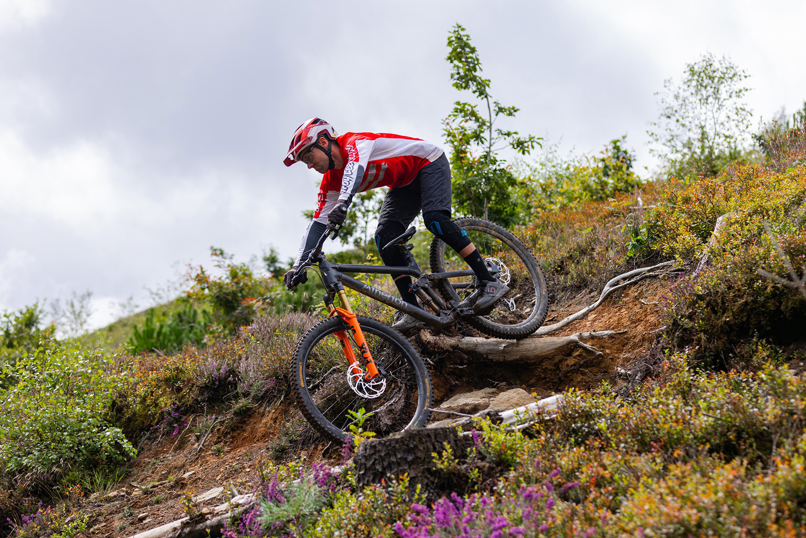 Male mountain biker in red top riding the Atherton A.130.3 mountain bike