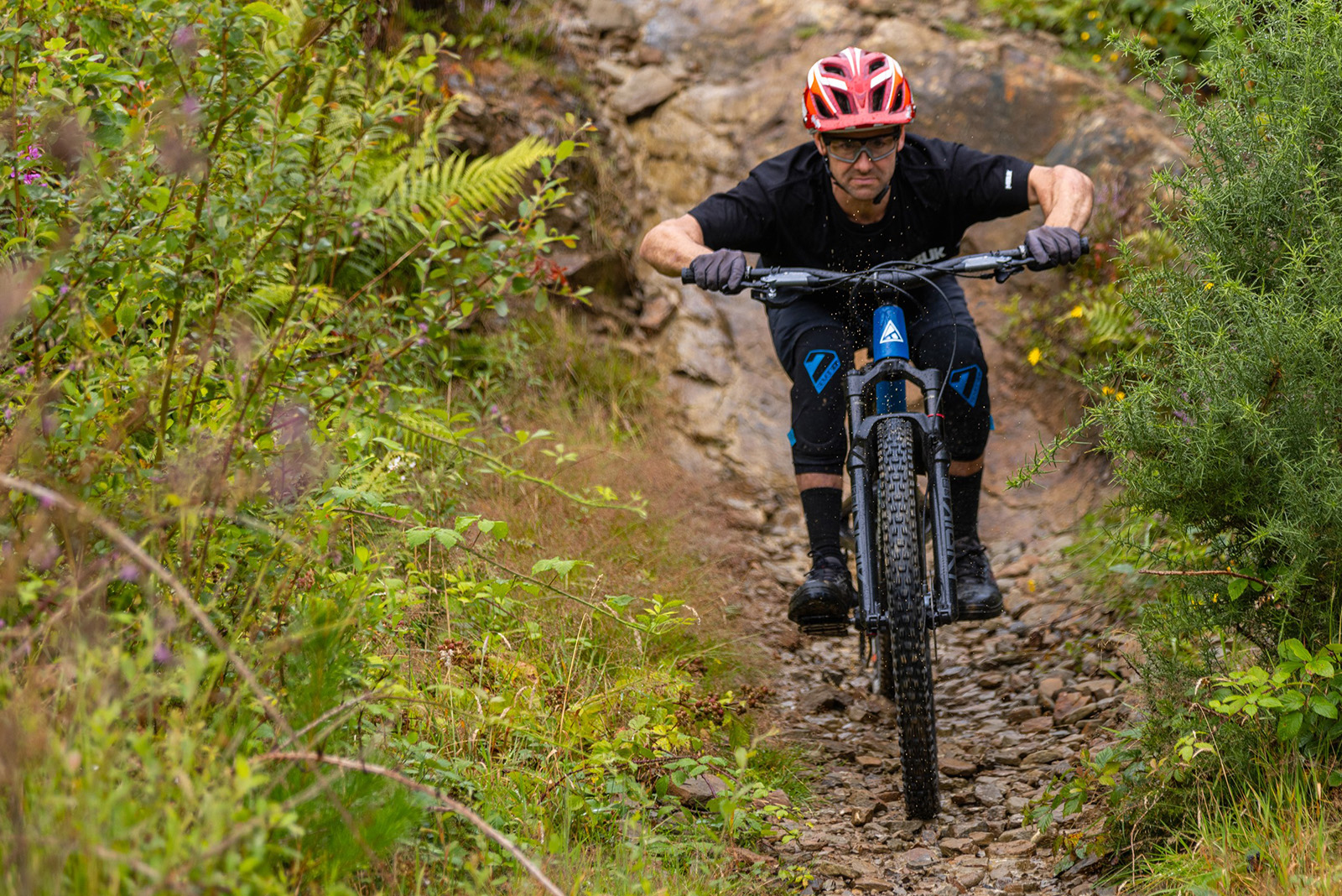 Male mountain biker in black top riding the Forbidden Druid 3 mountain bike