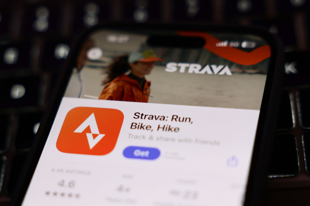 A laptop keyboard and Strava on App Store displayed on a phone screen are seen in this illustration photo taken in Krakow, Poland on January 15, 2025. (Photo by Jakub Porzycki/NurPhoto via Getty Images)