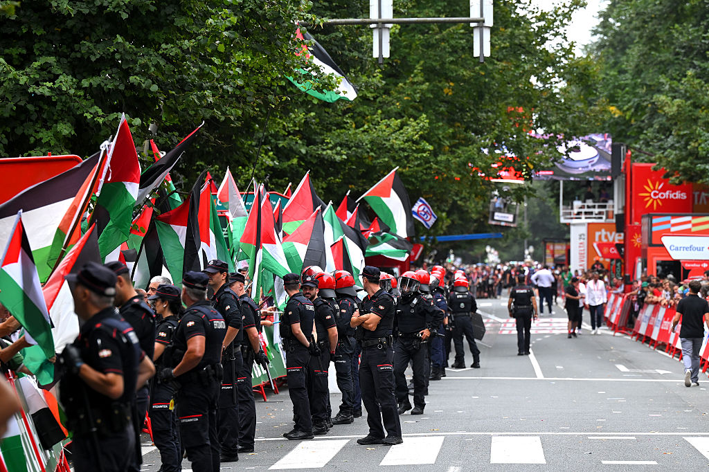 Police and pro-Palestine protestors at the finish line of stage 11 of La Vuelta.