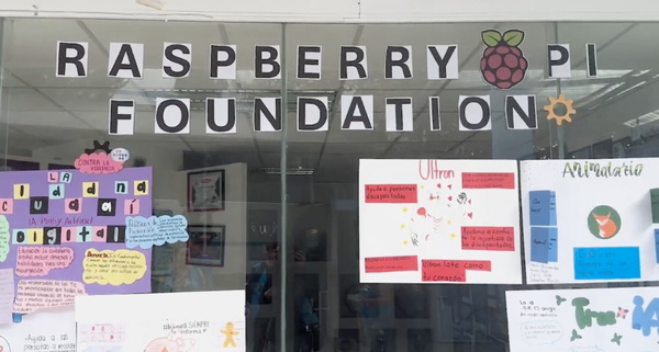 Young learners work on the classroom wall