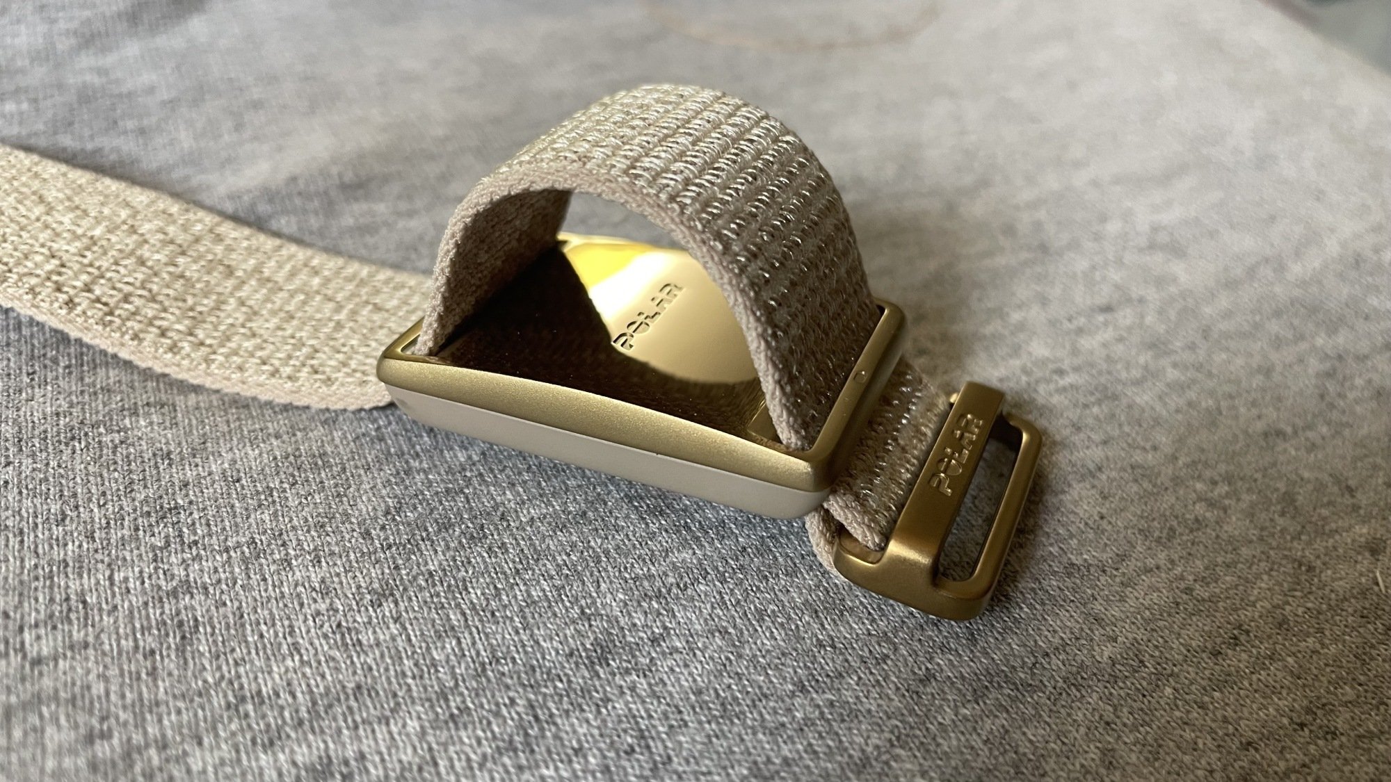 Polar Loop with strap pulled up, showing gold finish underneath