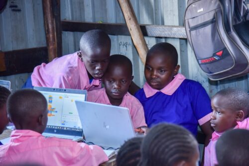 Young people use laptops to do their coding tasks.