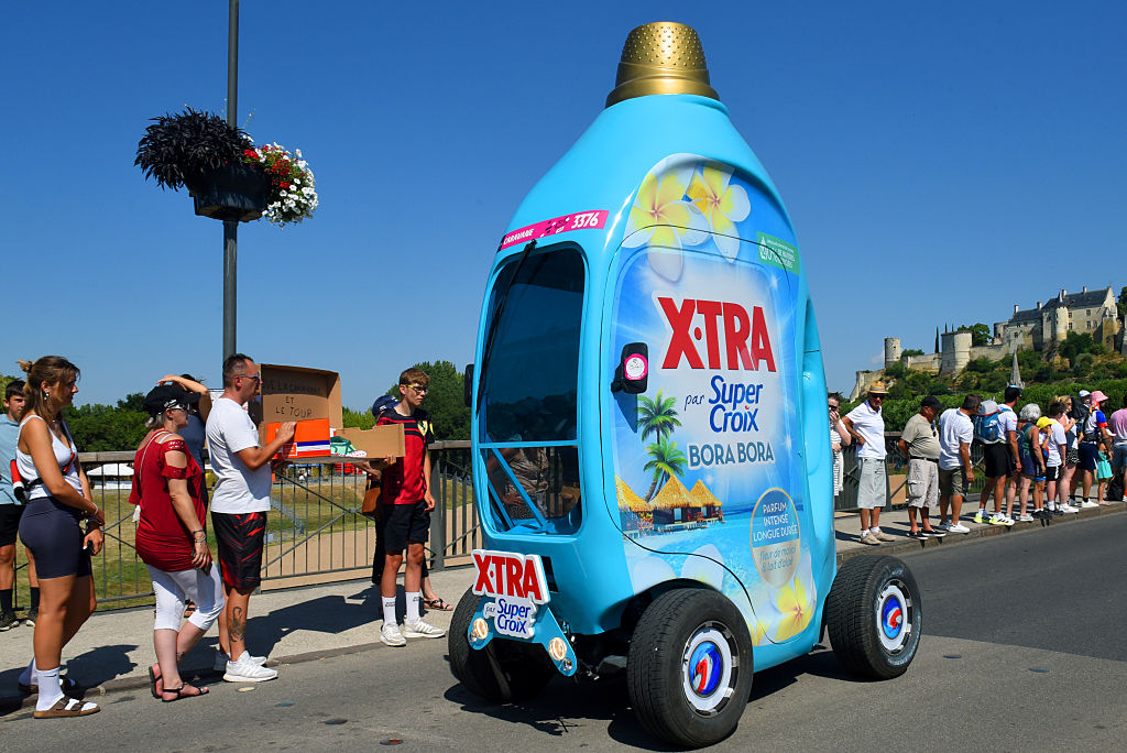Tour de France caravan with washing detergent vehicle.