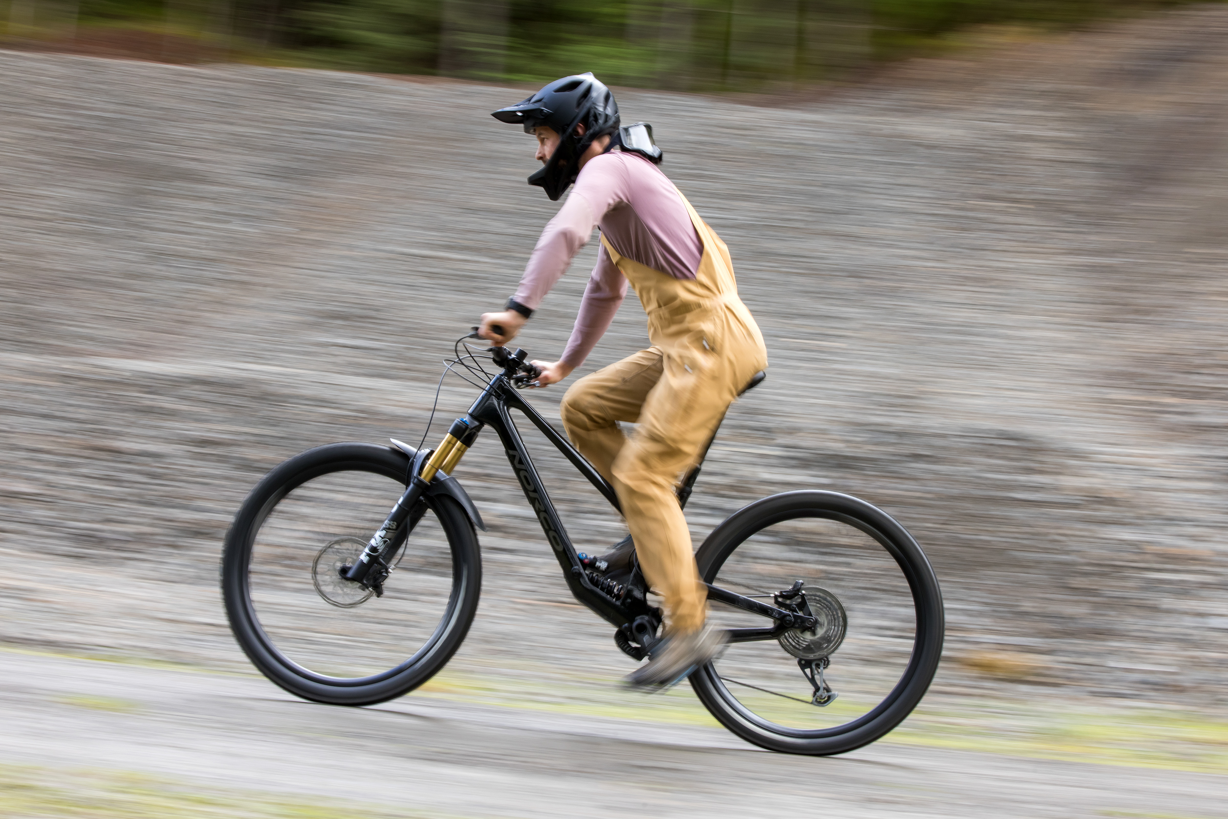 Norco Range C1 high pivot trail mountain bike ridden by male mountain bike tester Alex Evans on a trail called Too Hard For EWS in Scotland's Tweed Valley in the UK.
