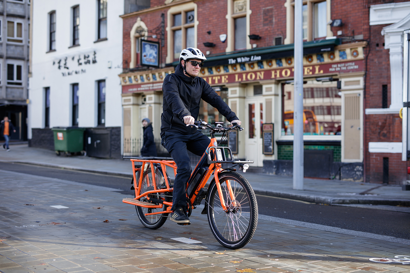 Male cyclist riding the Rad Power RadWagon electric cargo bike