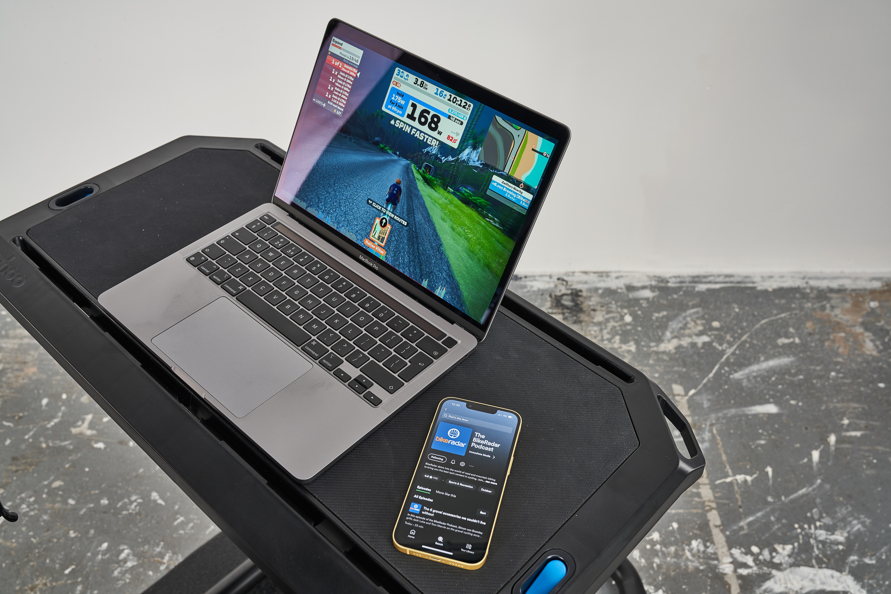 Zwift on a laptop and the BikeRadar Podcast on an iPhone Zwift on a laptop and the BikeRadar Podcast on an iPhone
